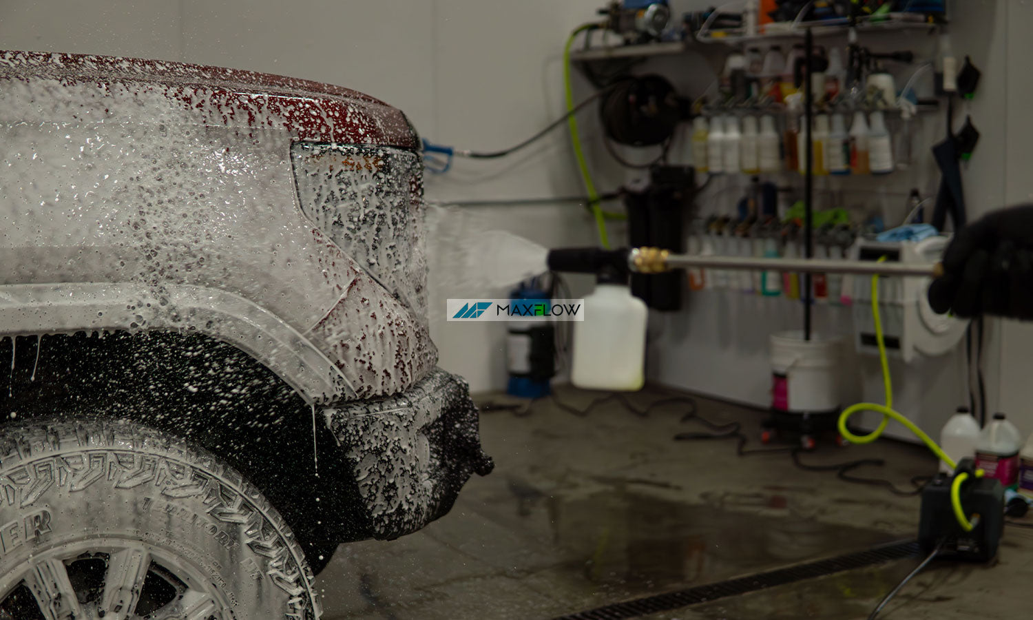 Maxflow Pressure Washer used on a red pickup truck with the logo overtop
