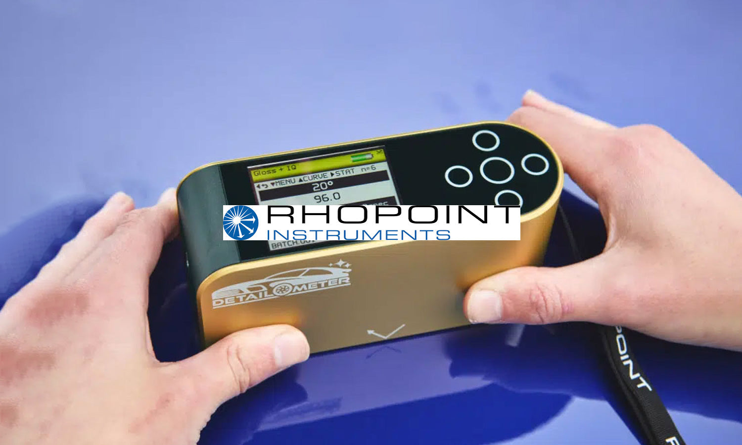 Rhopoint americas logo over detailometer in use