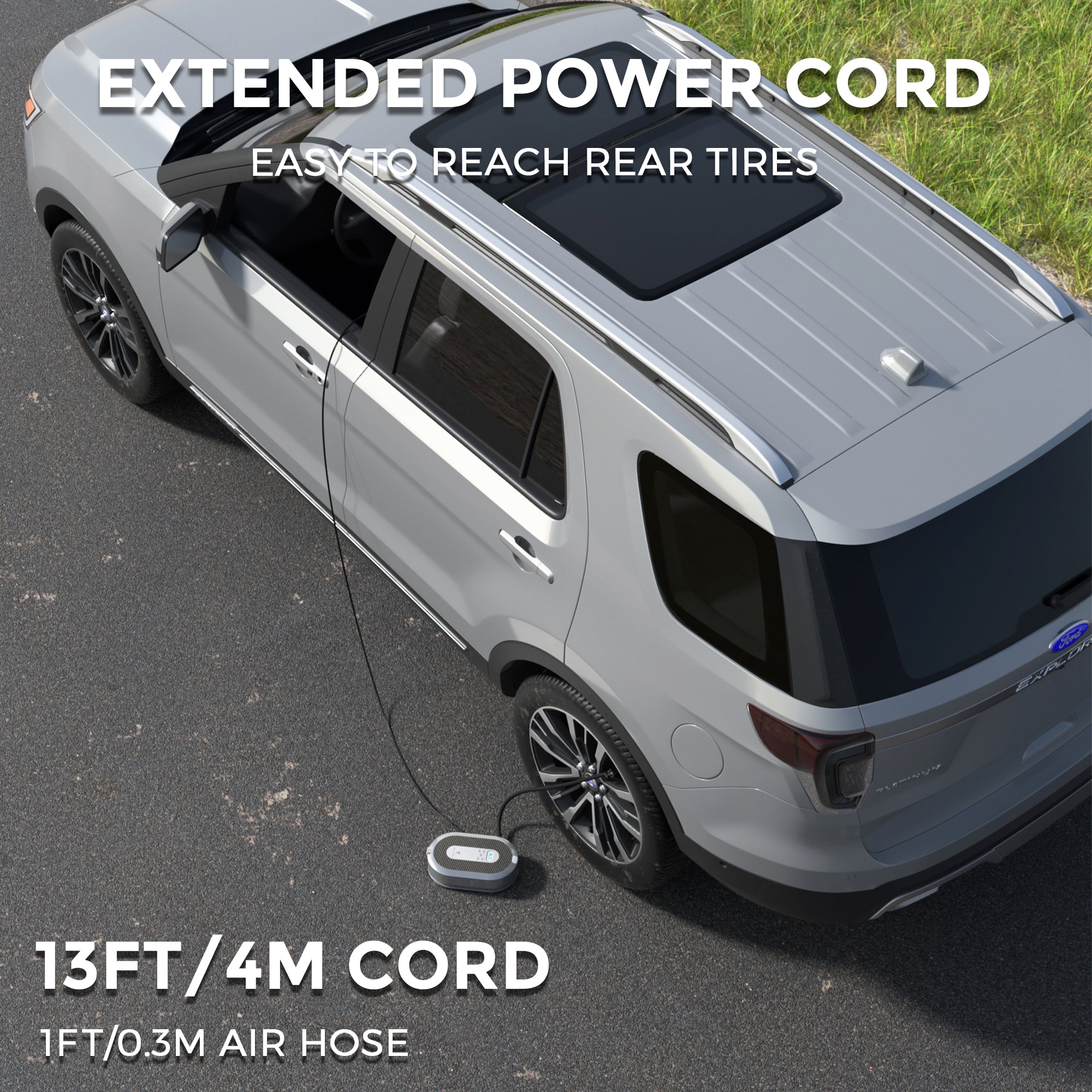 Gray SUV with extended power cord and air hose on a road