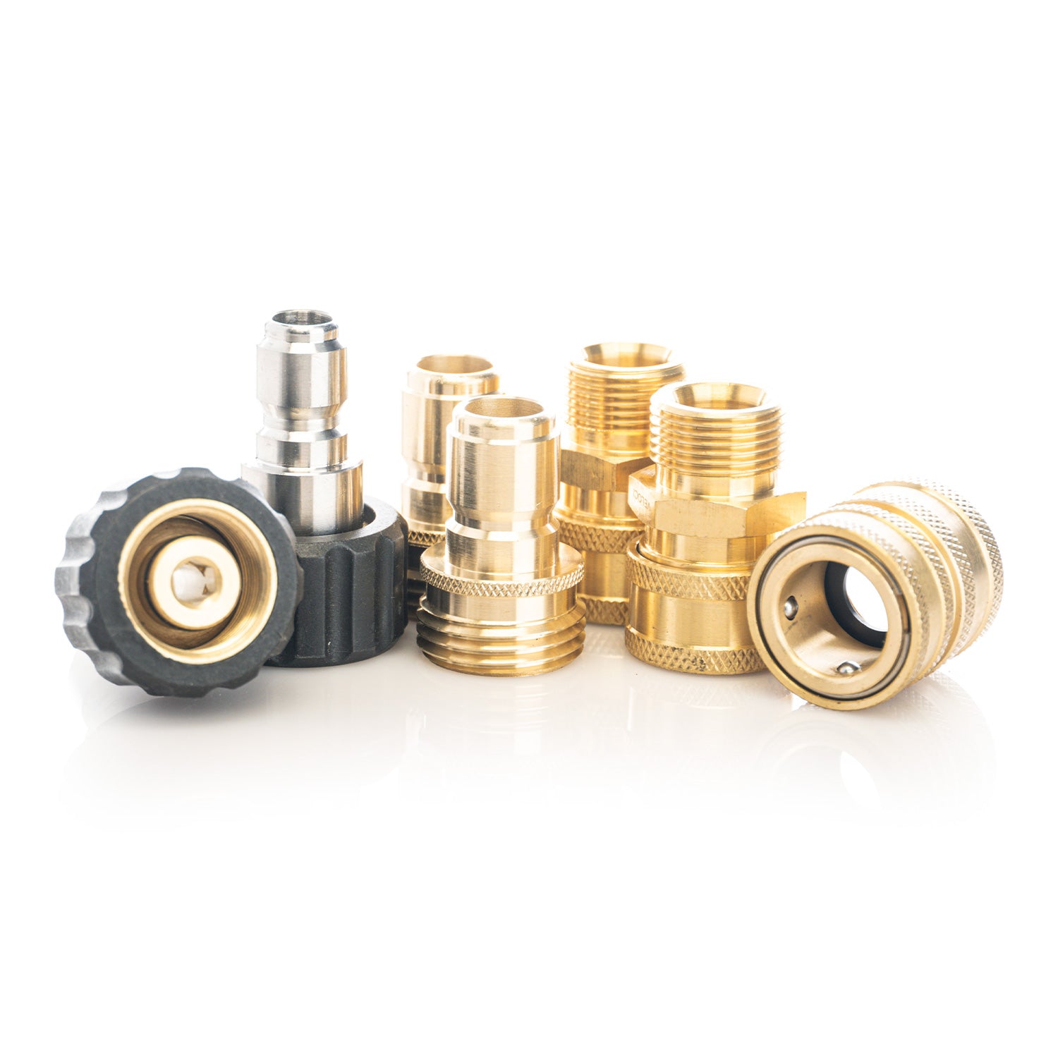Collection of brass and metal pressure washer fittings on a white background