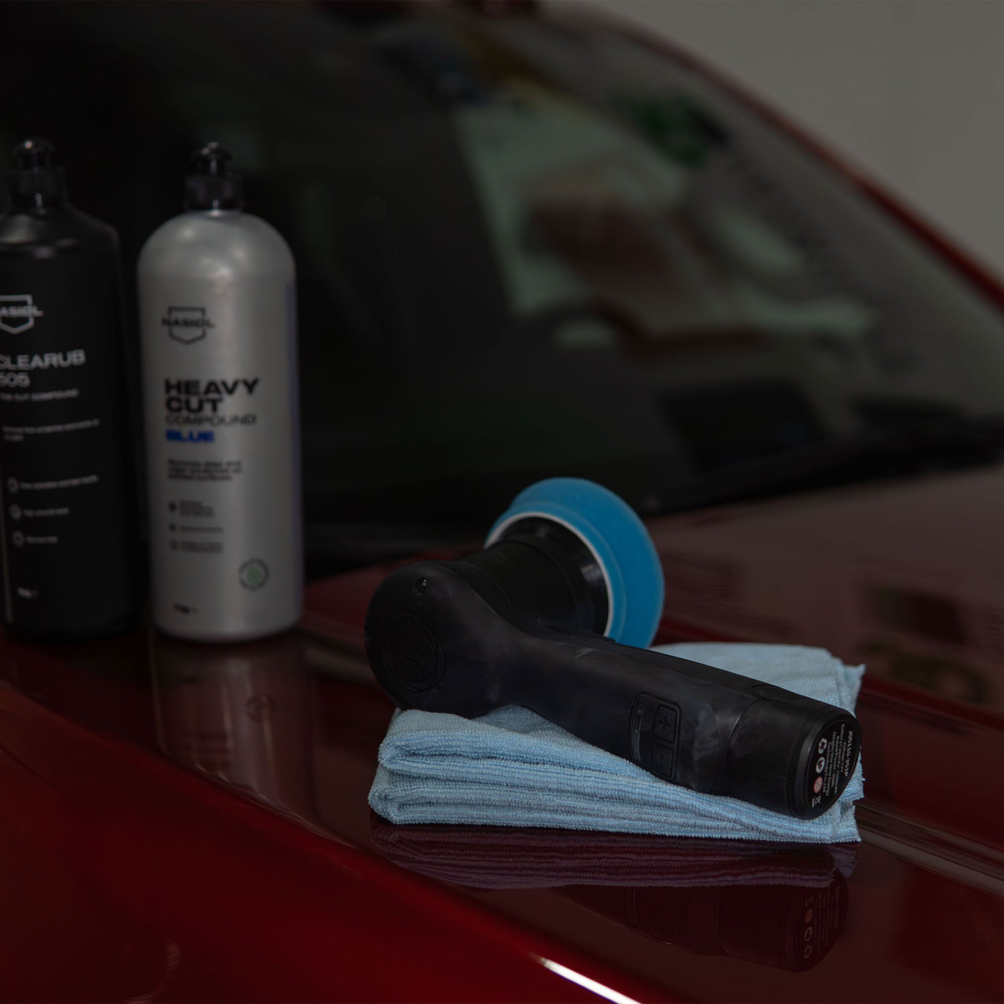 Raven 312 Polisher on a truck hood with nasiol compounds in a blurred background