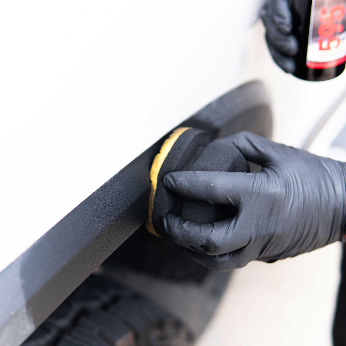 Applying duration tire dressing to black vinyl with a hex sponge applicator