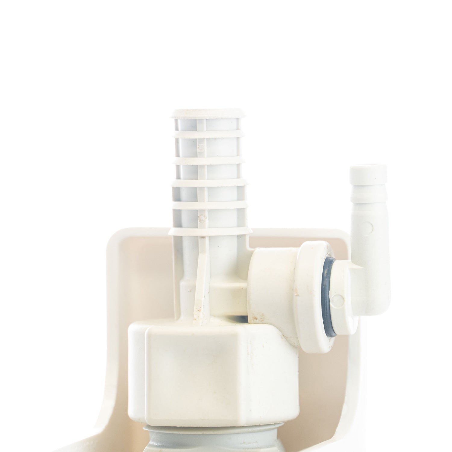 White plastic DEMA Eductor fitting installed on DEMA unit on a white background