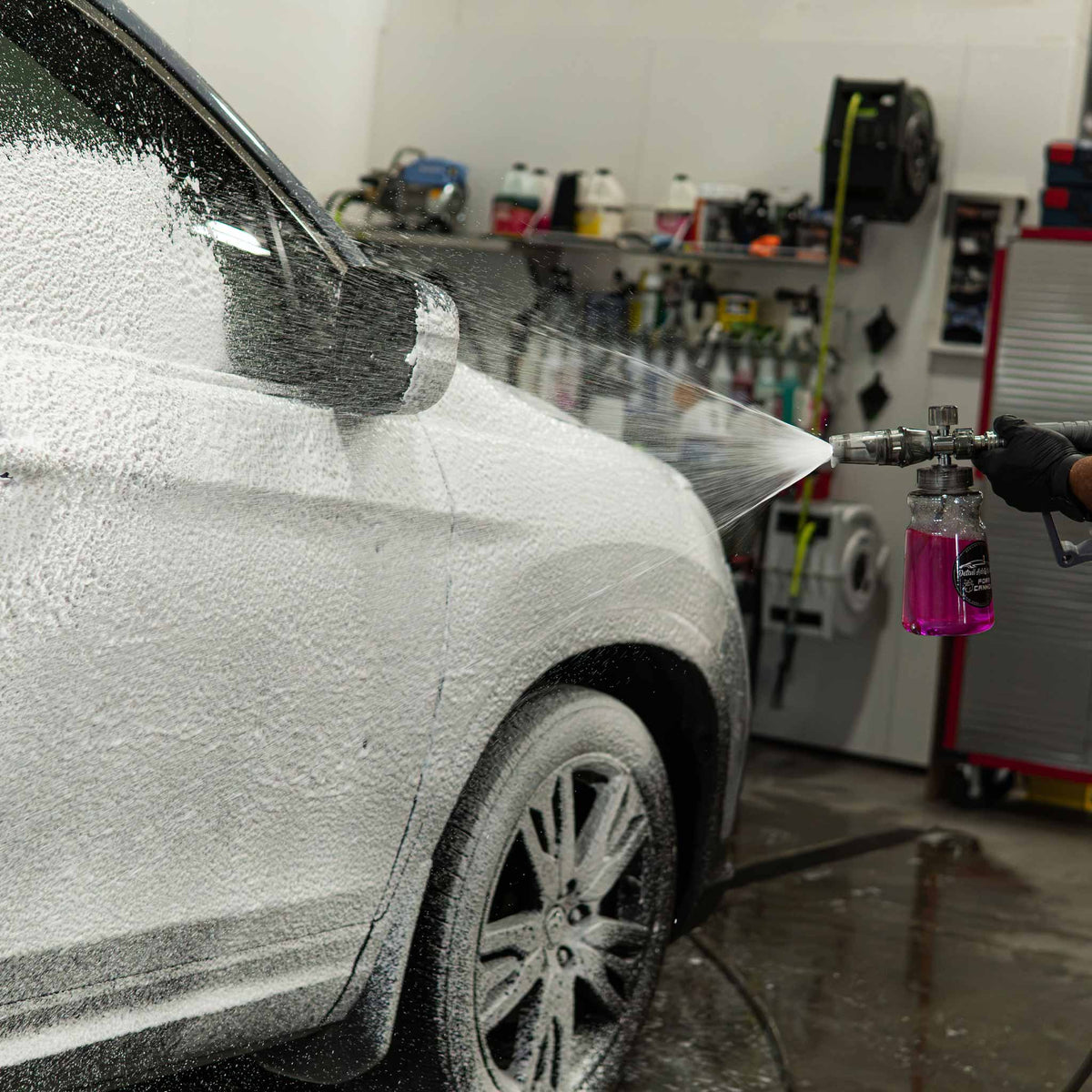 Stinger Chemical Bubblicious 704 snow foam sprayed over a car with a foam cannon