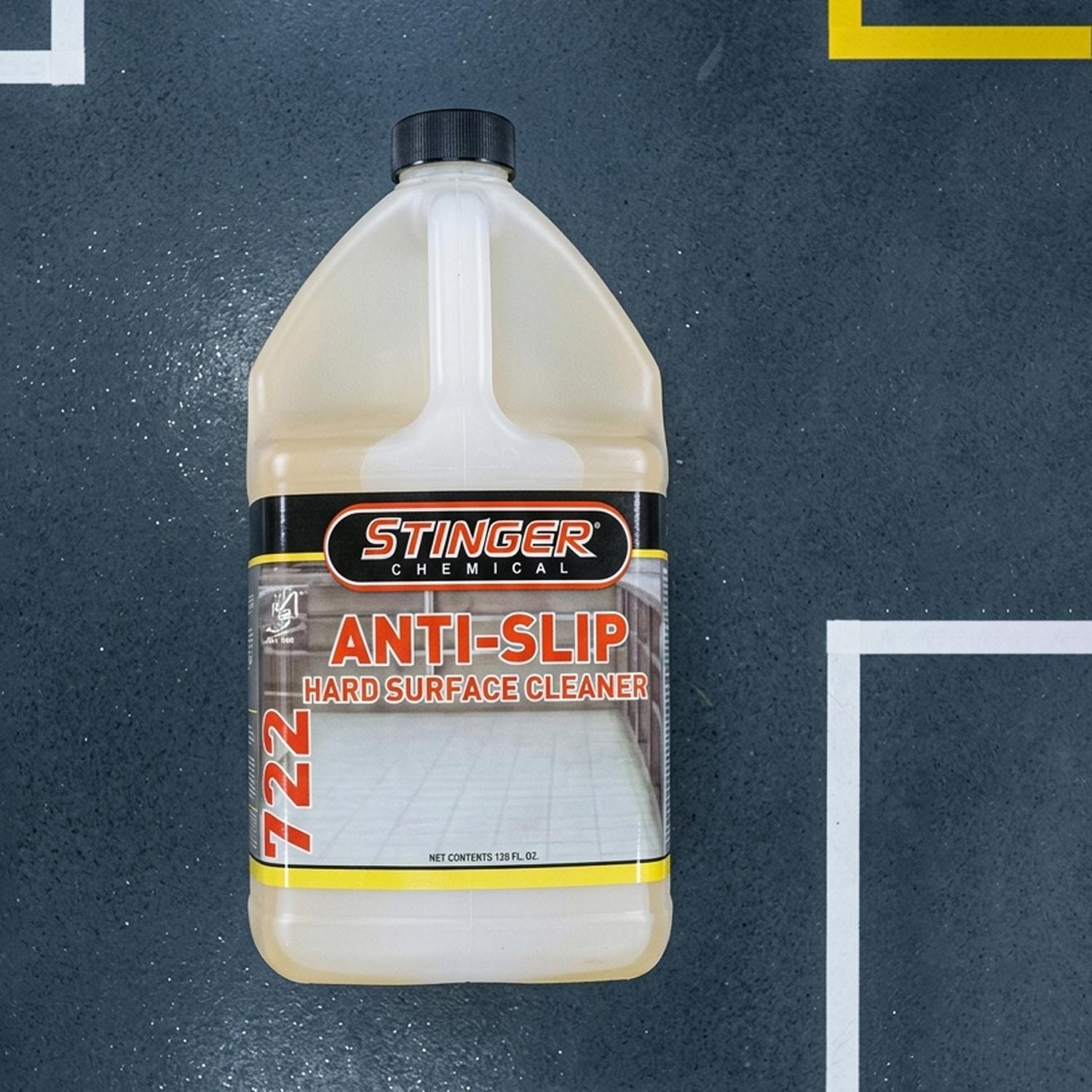 Bottle of Stinger Chemical Anti-Slip Hard Surface Cleaner on a dark background