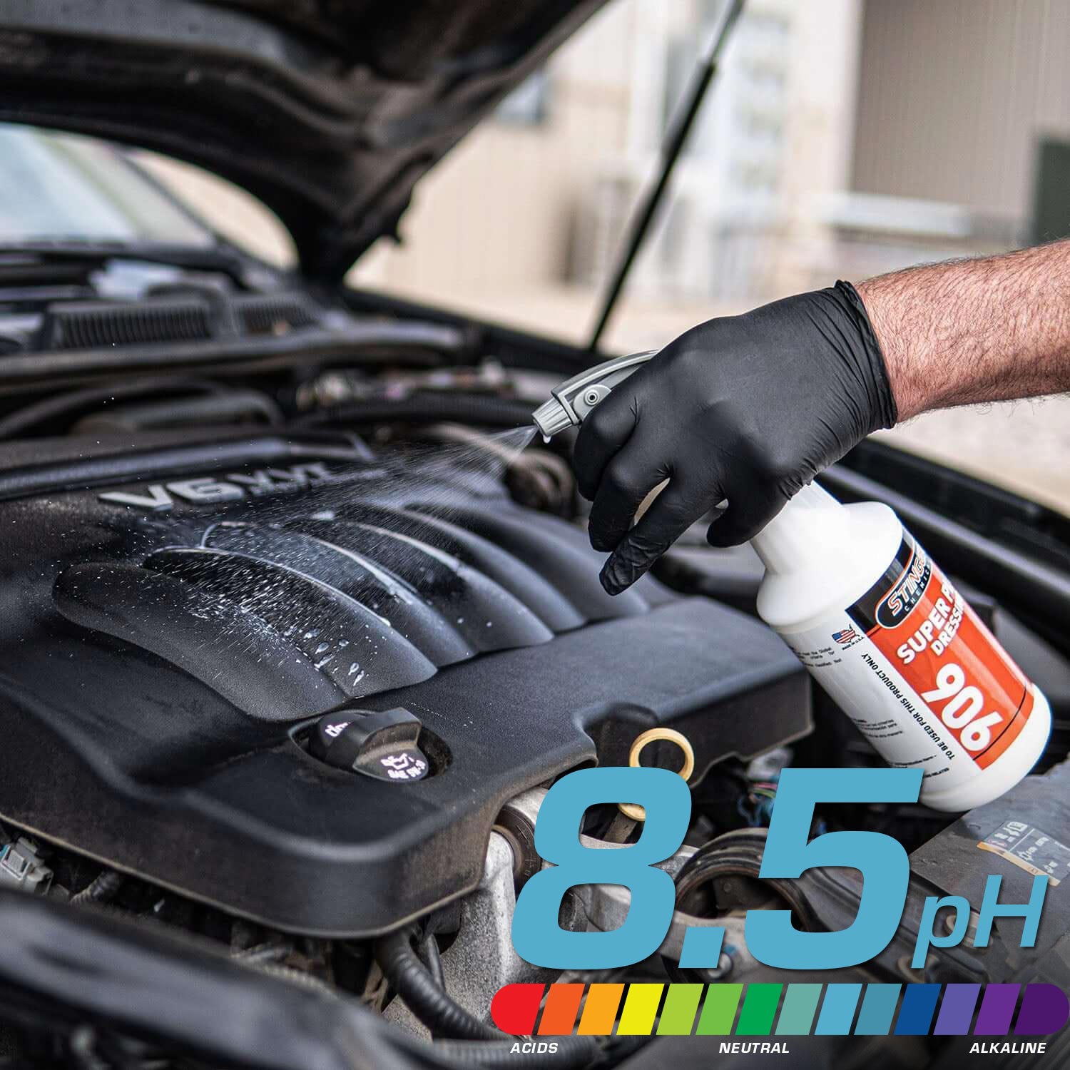 Person using a bottle labeled 'Super dressing 906' on a car engine with a pH indicator showing 8.5.