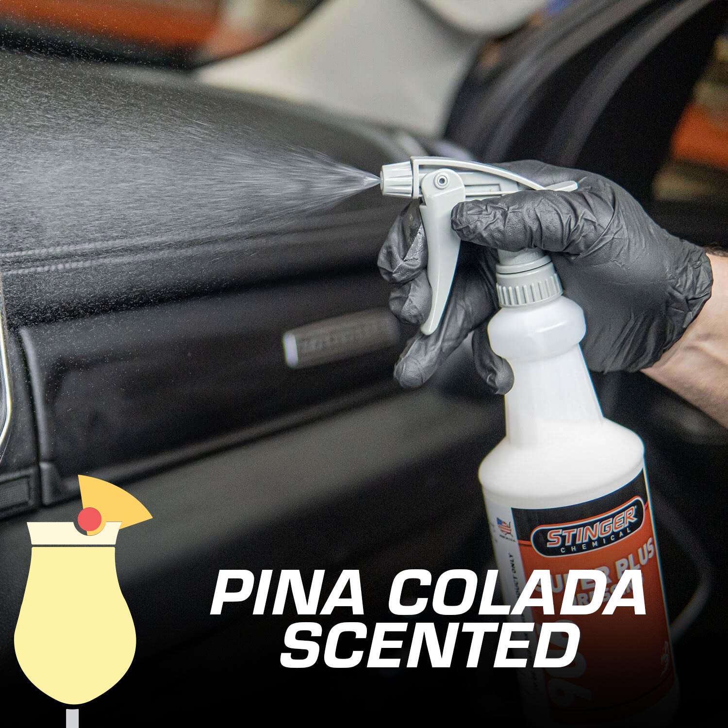 Person using a Stinger Pina Colada scented spray bottle on a car interior.