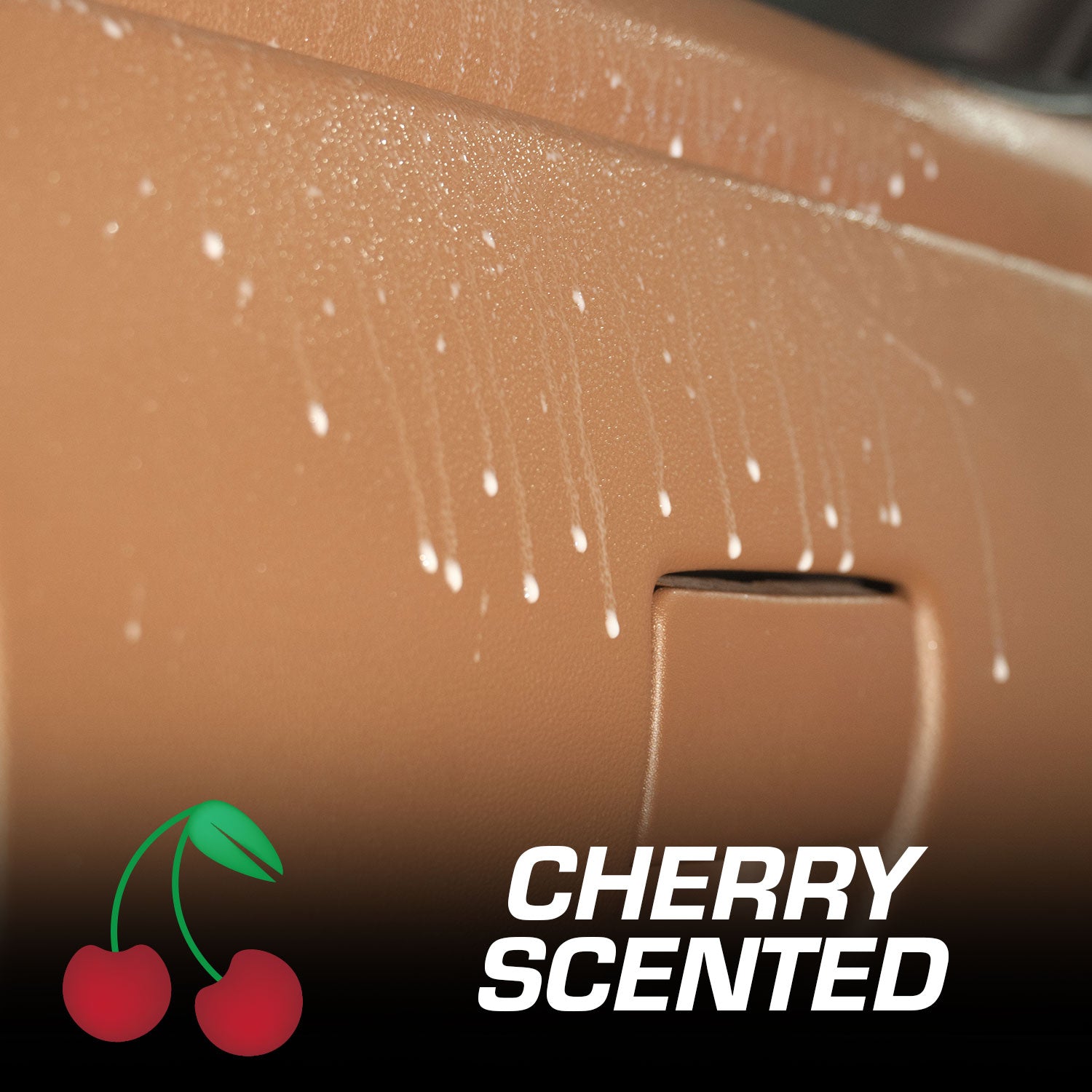 Close-up of a car dash with cherry-scented product being applied, featuring a cherry logo and text.
