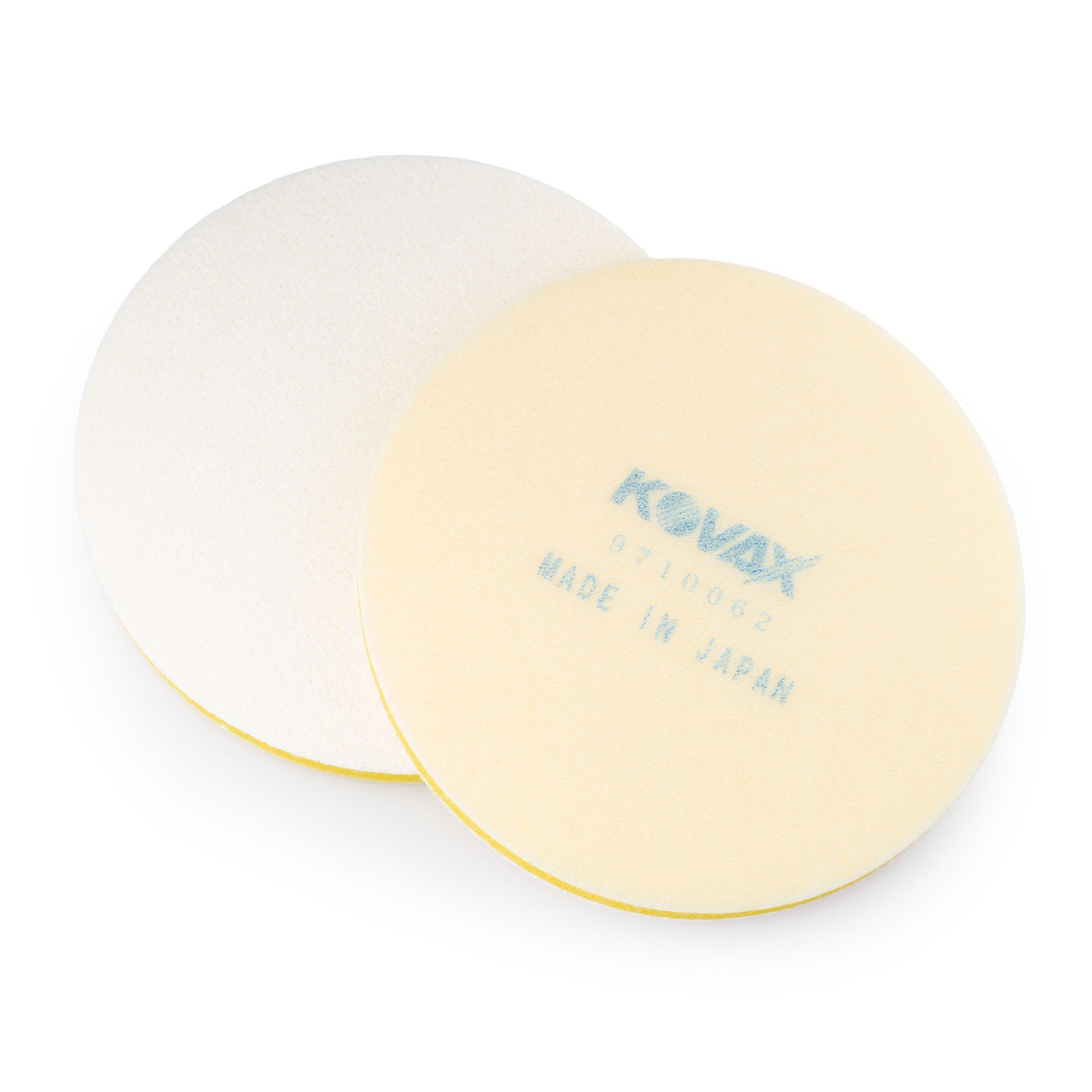 Two sanding interface pads with yellow edges on a white background