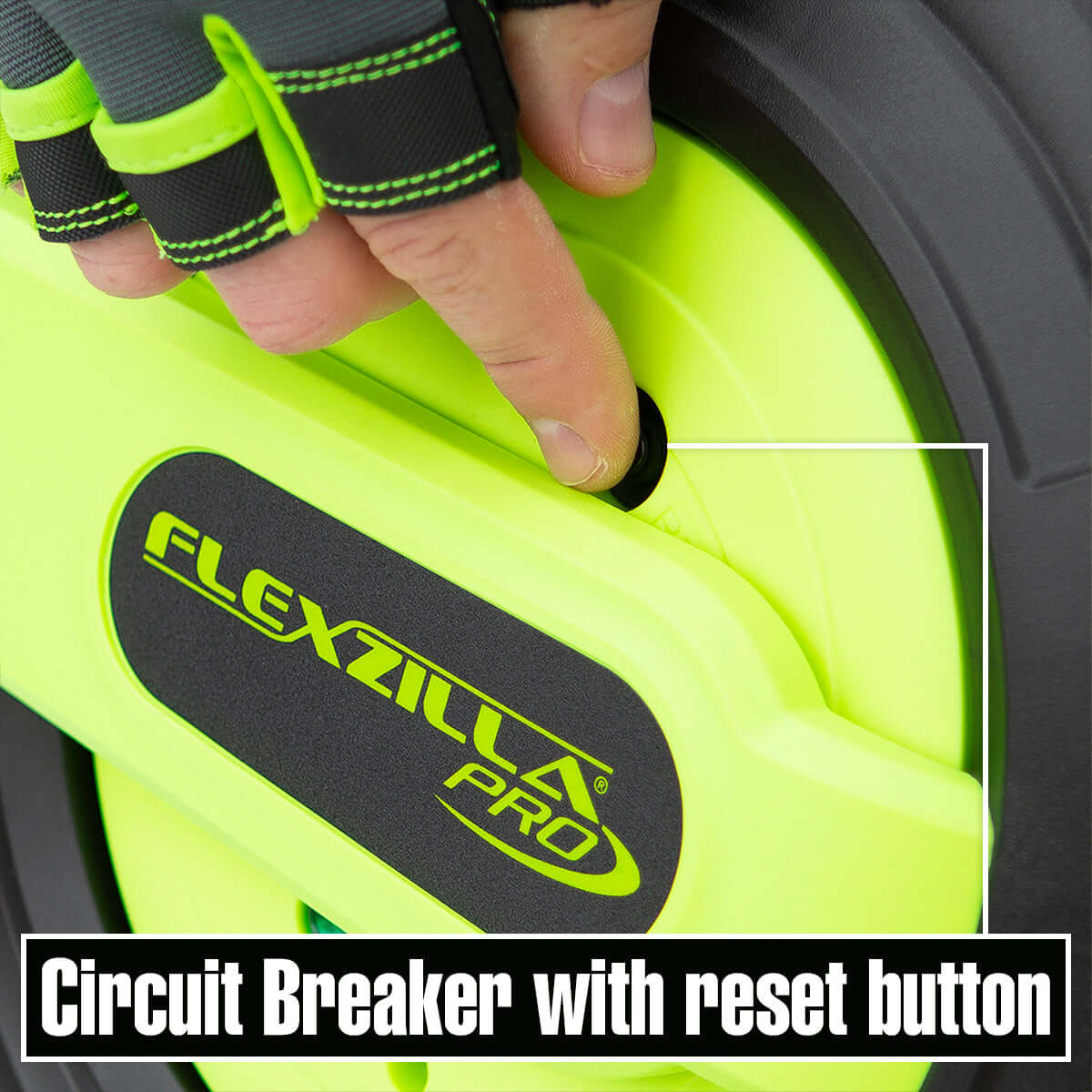 Hand pressing a reset button on a Flexzilla Pro extension cord reel