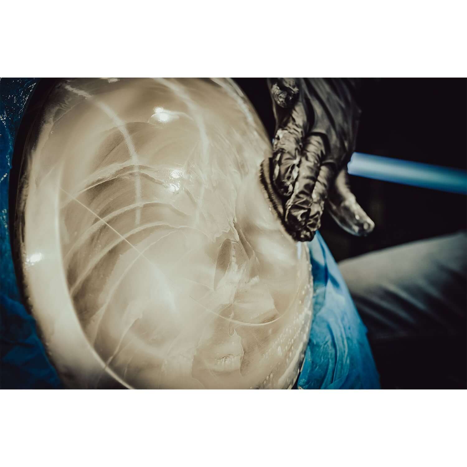 Sanding a Headlight with Slurry
