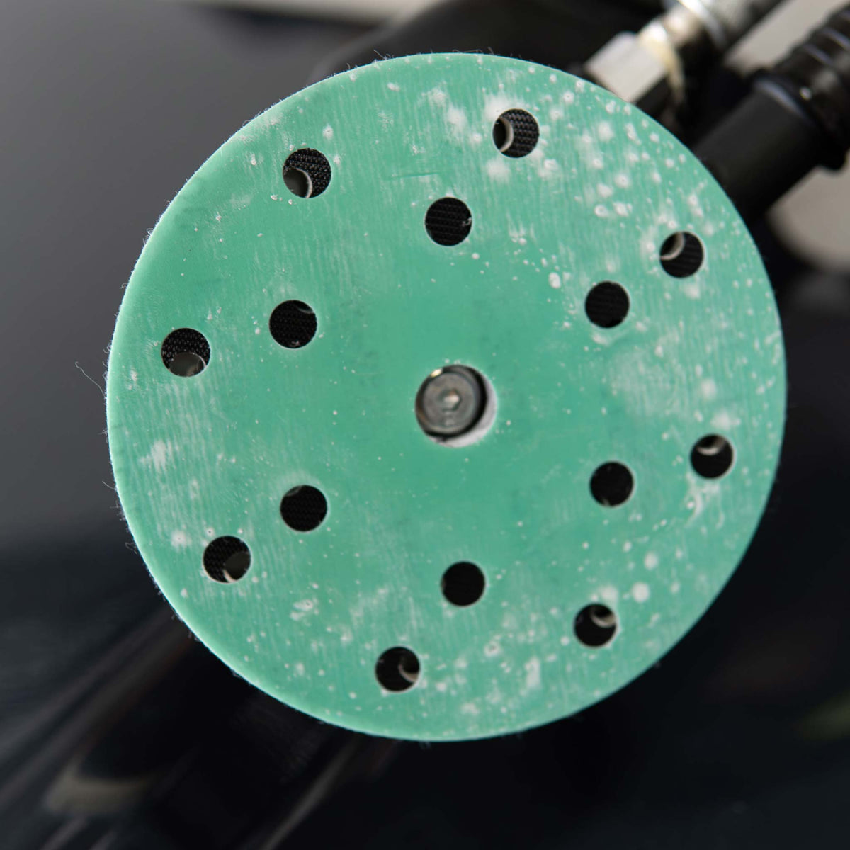 Used RUPES PROCUT disc face loaded with white clear coat dust after dry sanding