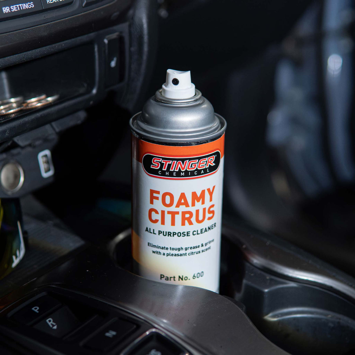 Stinger Chemical Foamy Citrus 600 car interior cleaner in a center console cup holder