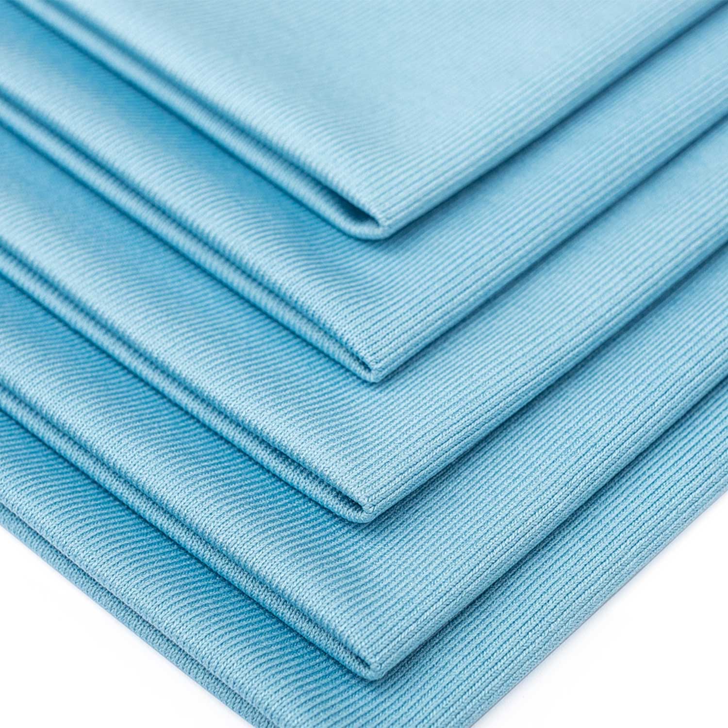 Stack of light blue glass towels on a white background