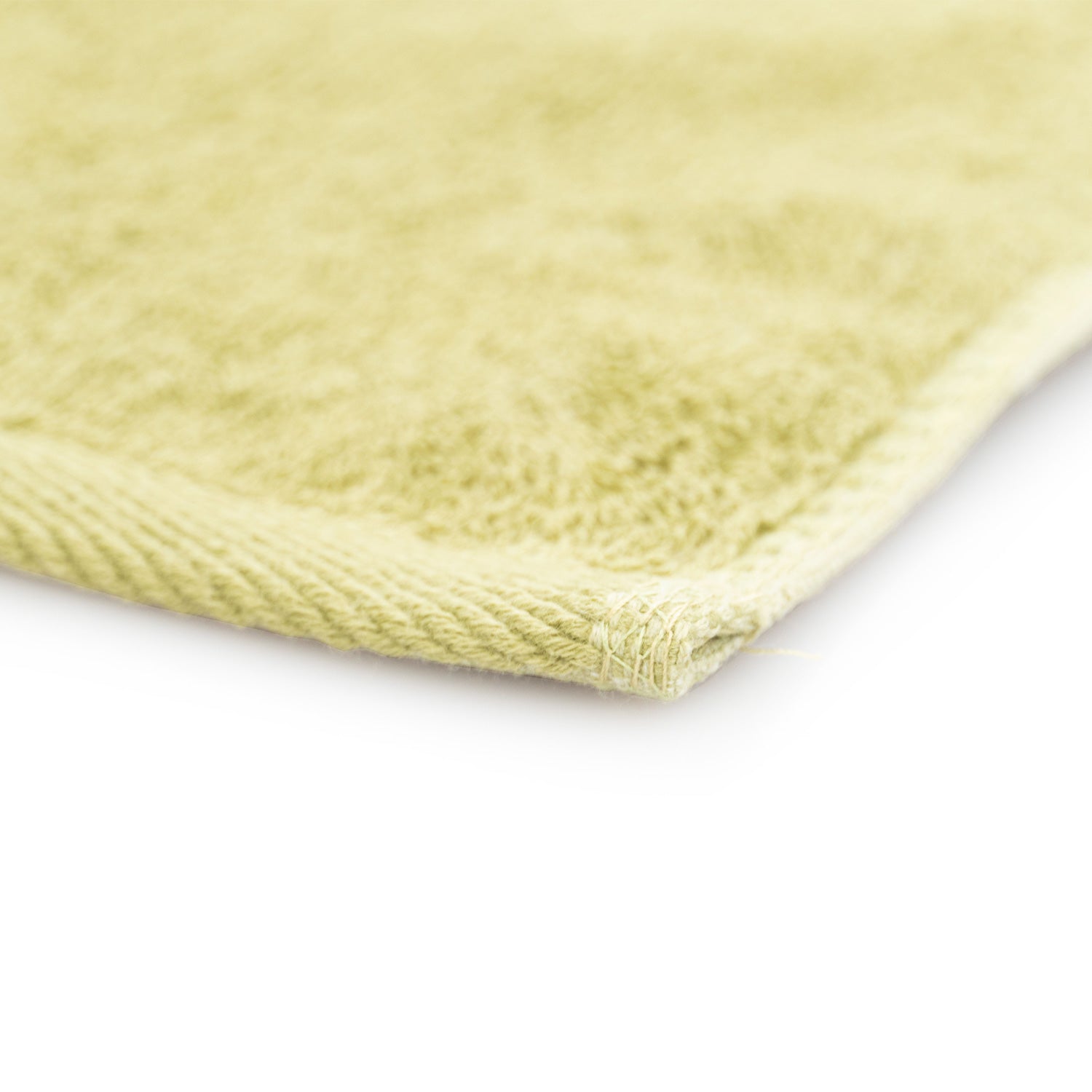 Close-up of a olive green towel on a white background