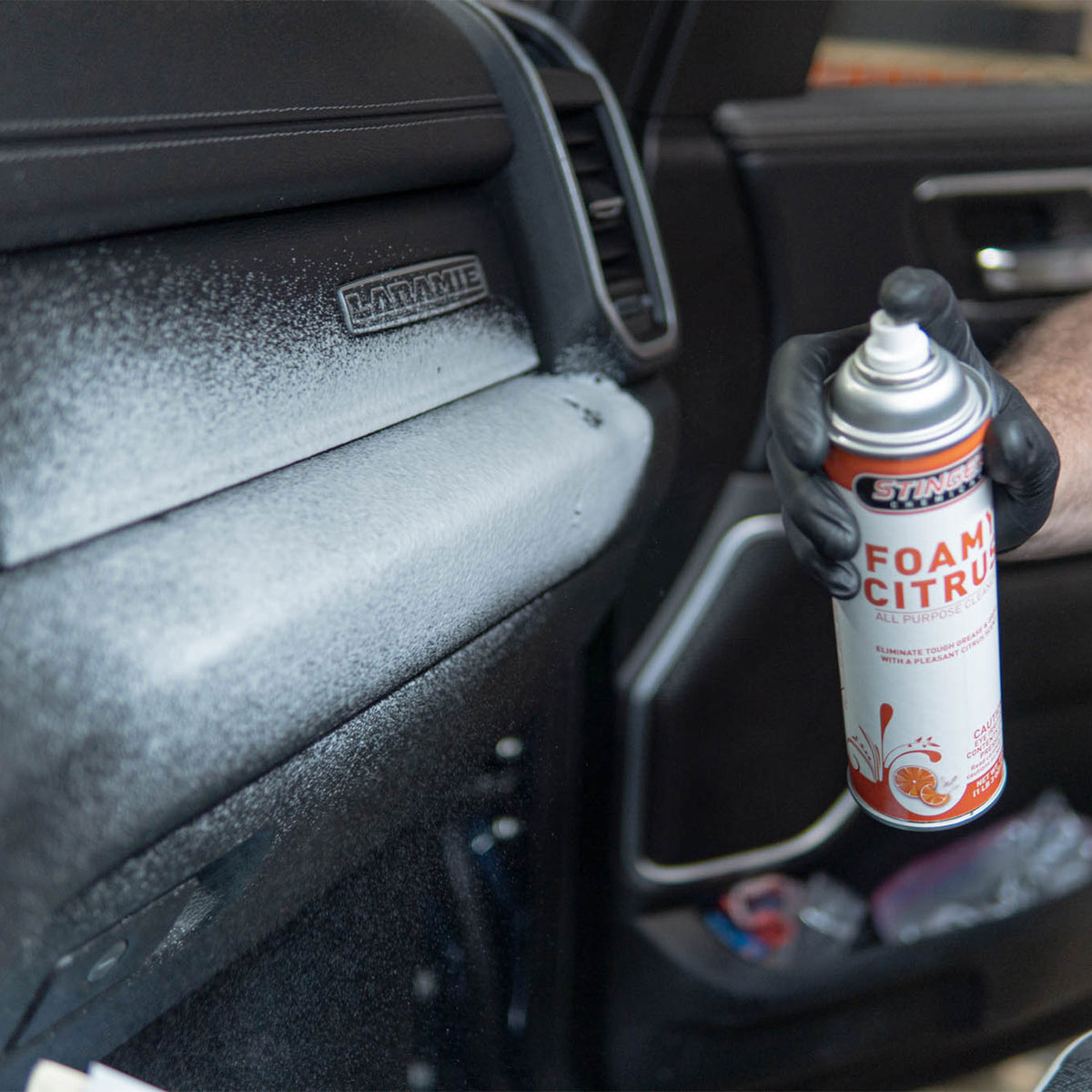 Stinger Chemical Foamy Citrus 600 aerosol foam cleaning a textured truck dashboard