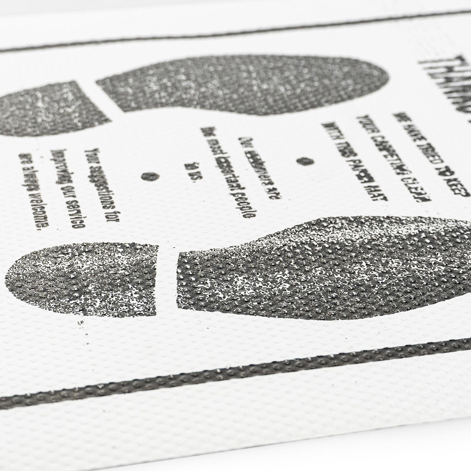 Close-up of a printed document with text and a fingerprint-like design.