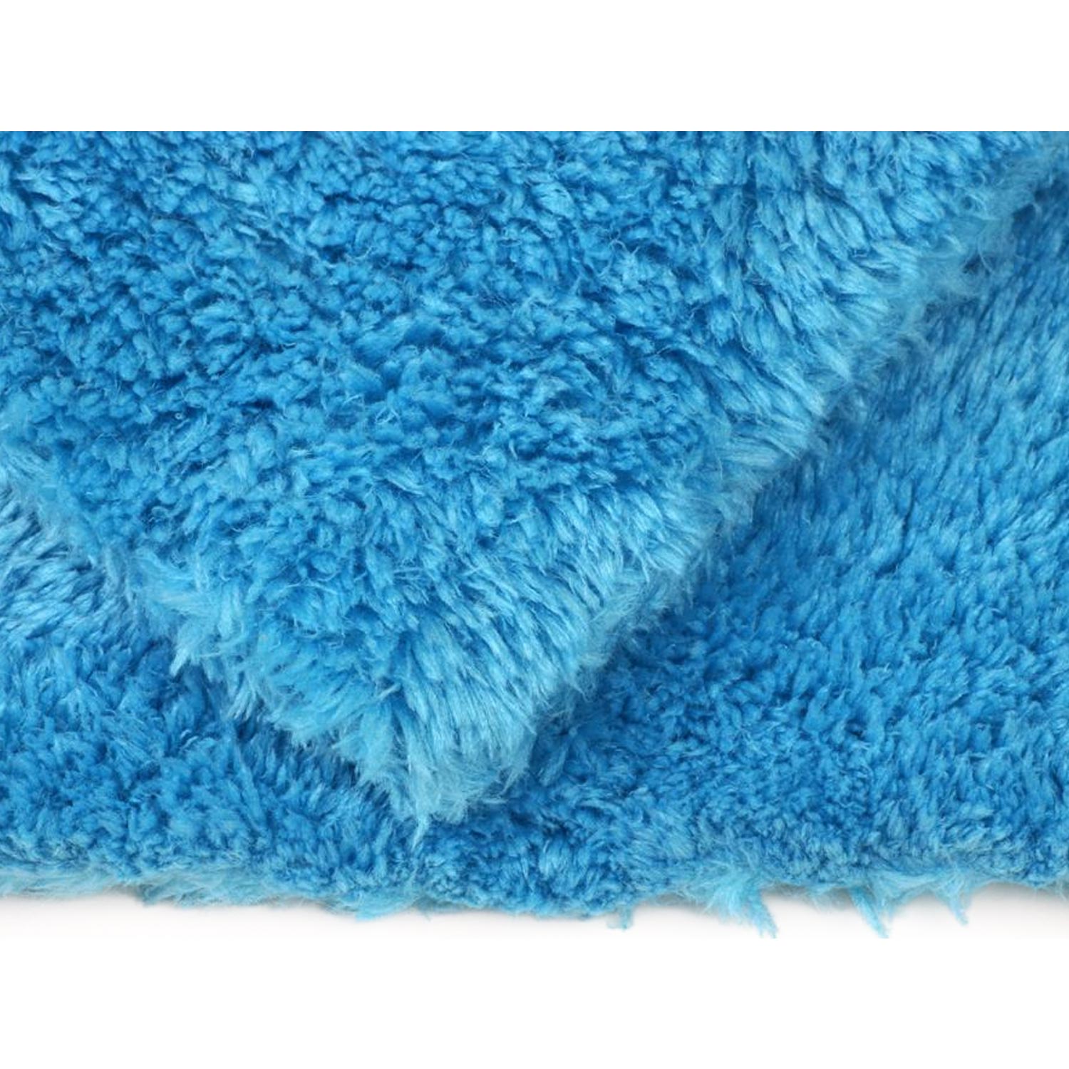 Close-up of a blue textured plush towel on a white background
