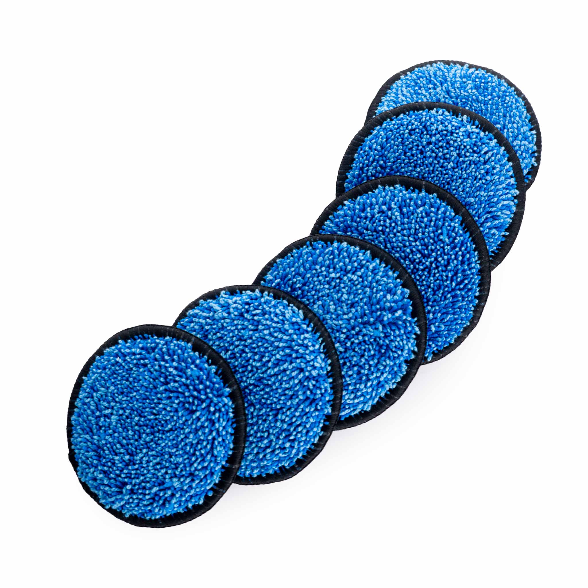 Set of blue circular upholstery cleaning pads with black edges on a white background