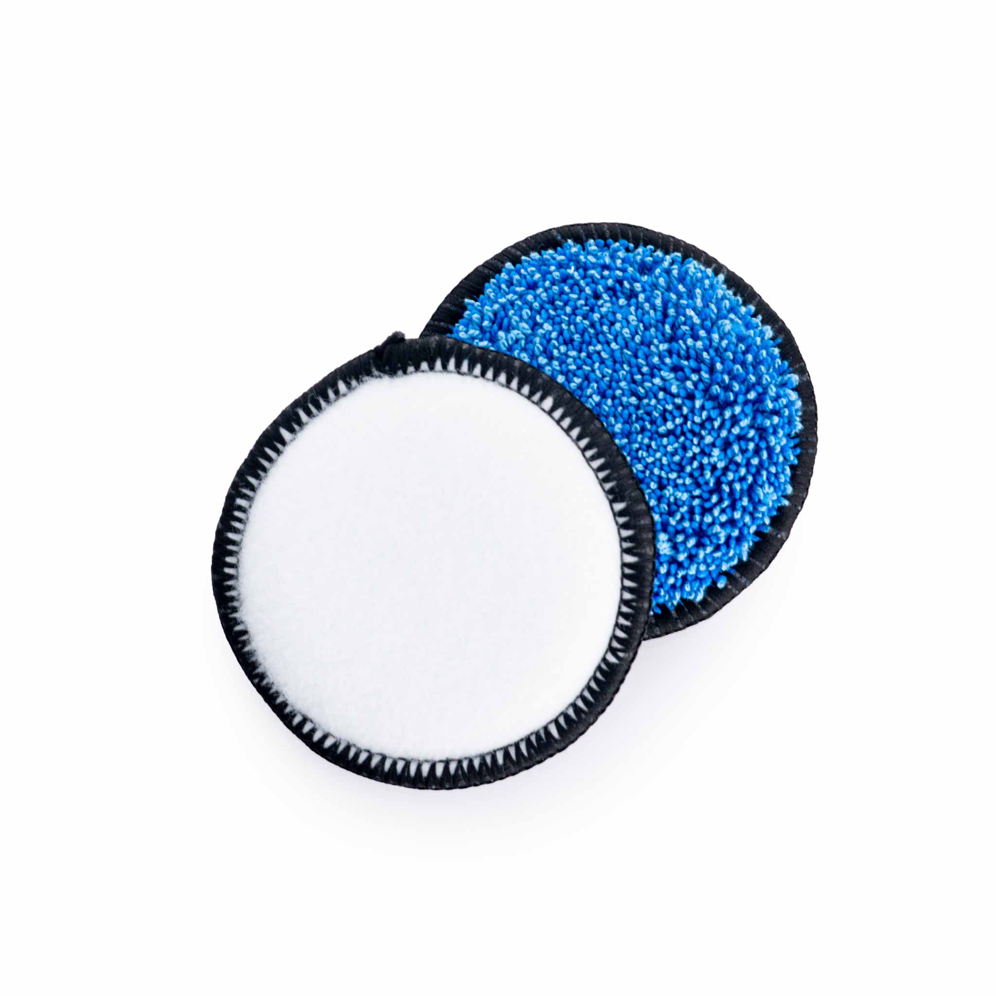 Two circular UFO Pads, one white and one blue with black rim, on a white background.