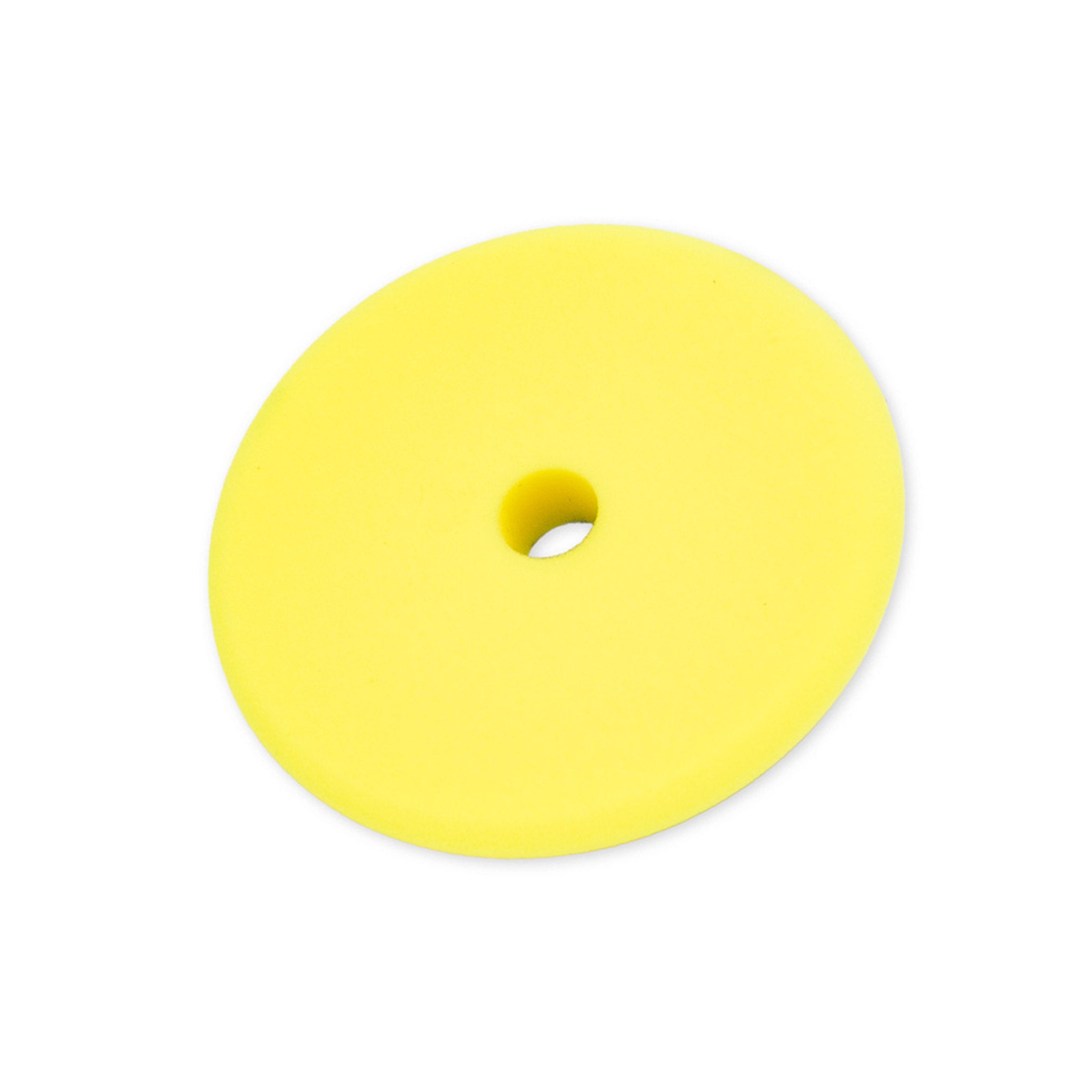 Yellow Foam buffing pad on a white background