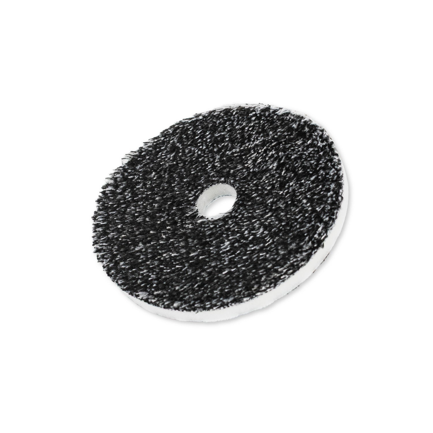 Round black and white uro-fiber buffing pad on a white background