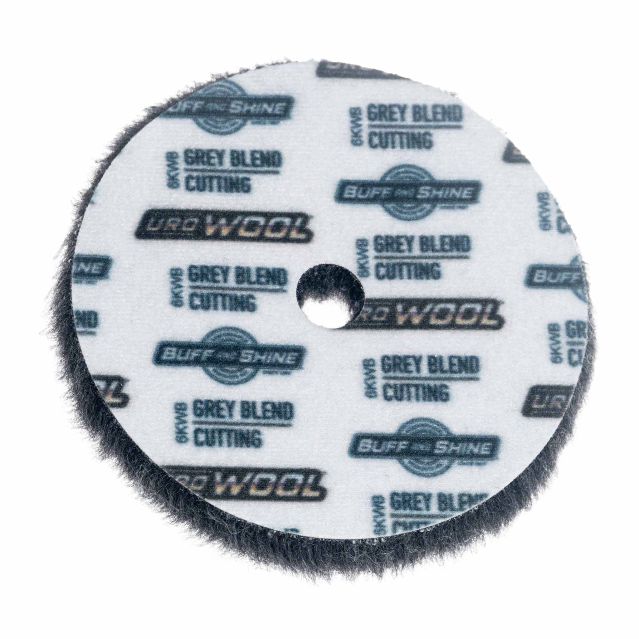 Round Uro-Wool Grey Cutting pad with branding on a white background
