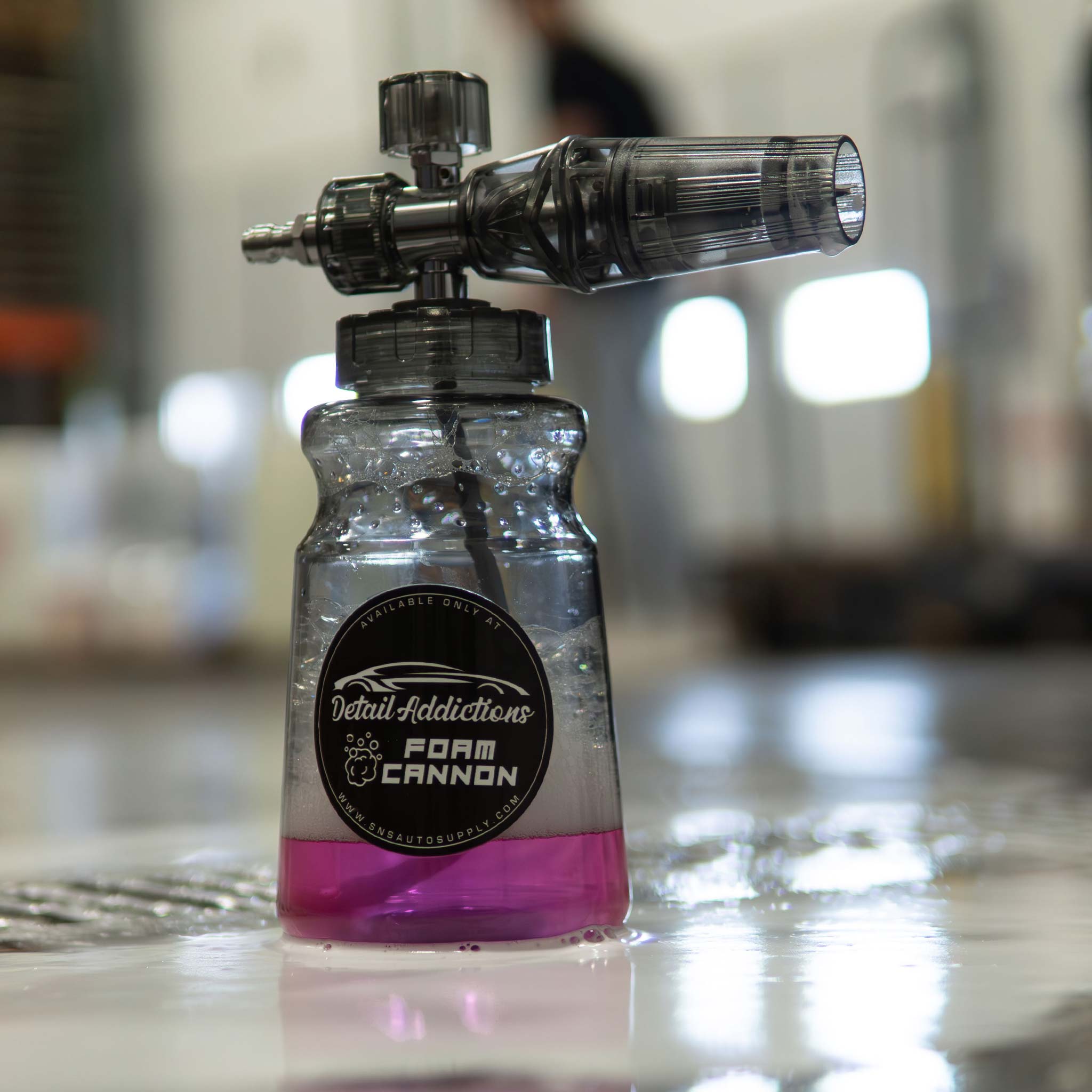 clear foam cannon with stinger bubblicious in a shop setting