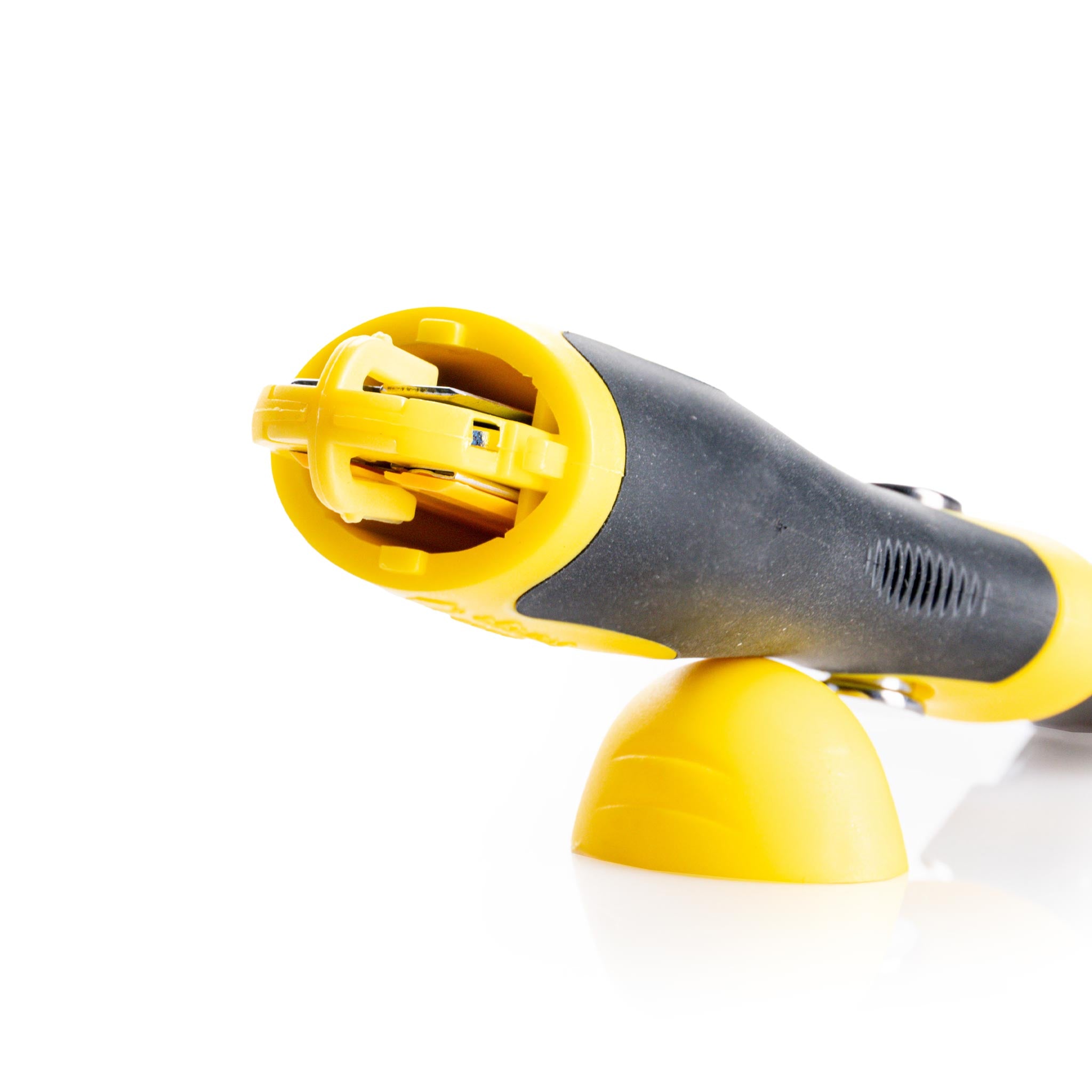 Close-up of a yellow and black razor blade scraper storage on a white background