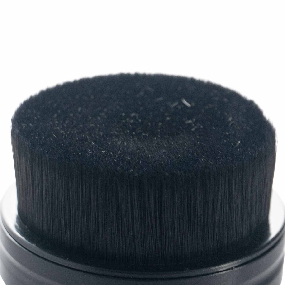 Close up of the dense black nylon bristles on the Detail Addictions tire dressing brush