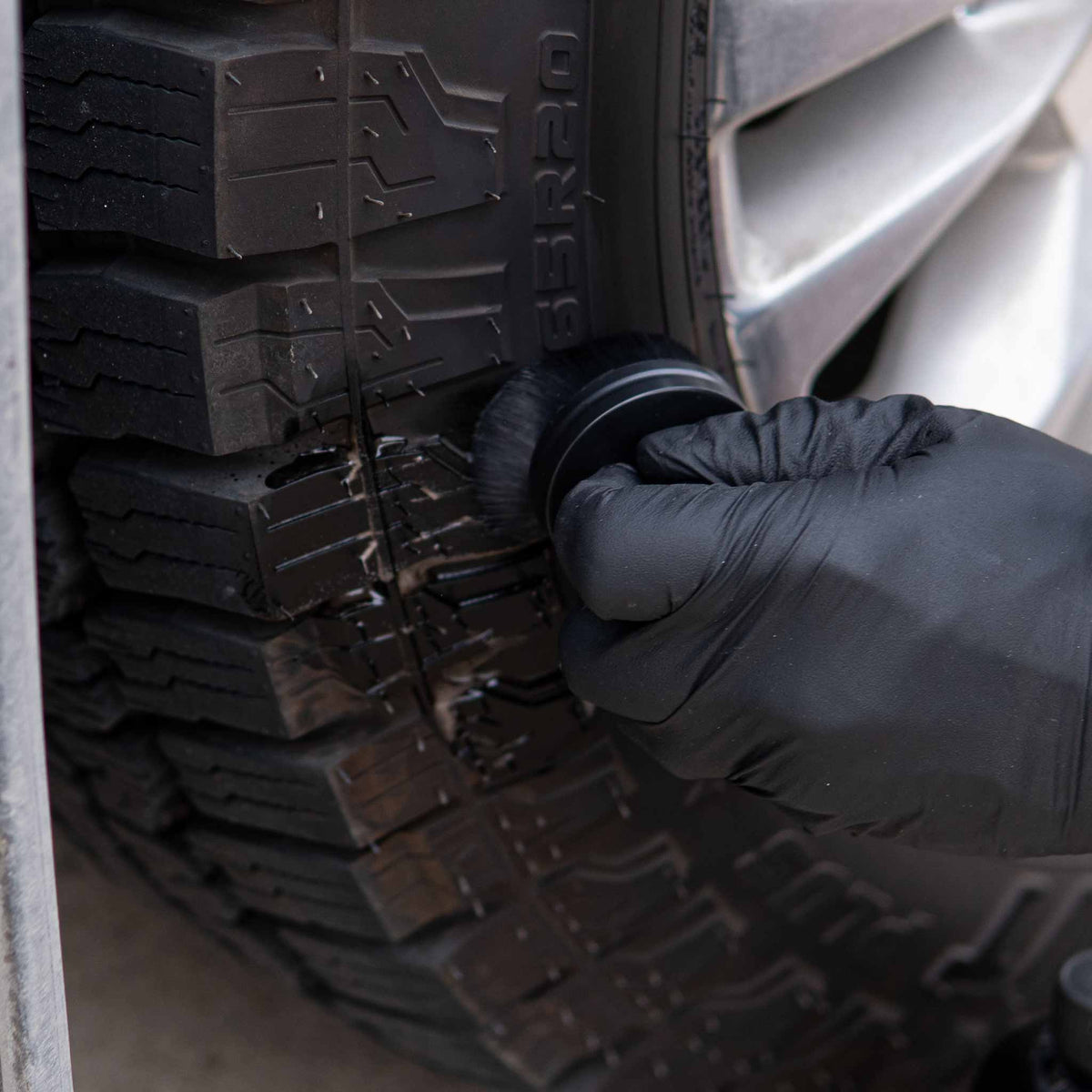 Working tire dressing into the raised lettering and sidewall of an all terrain tire