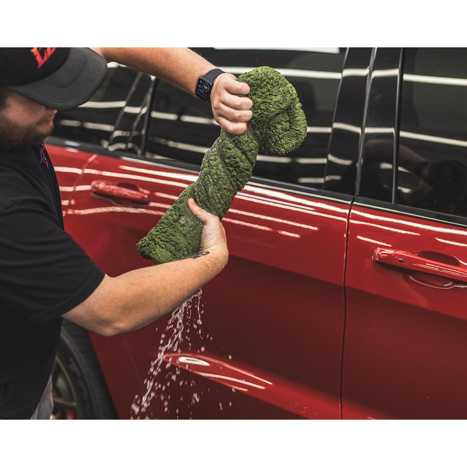 Person wringing out a liquid8r M22 towel