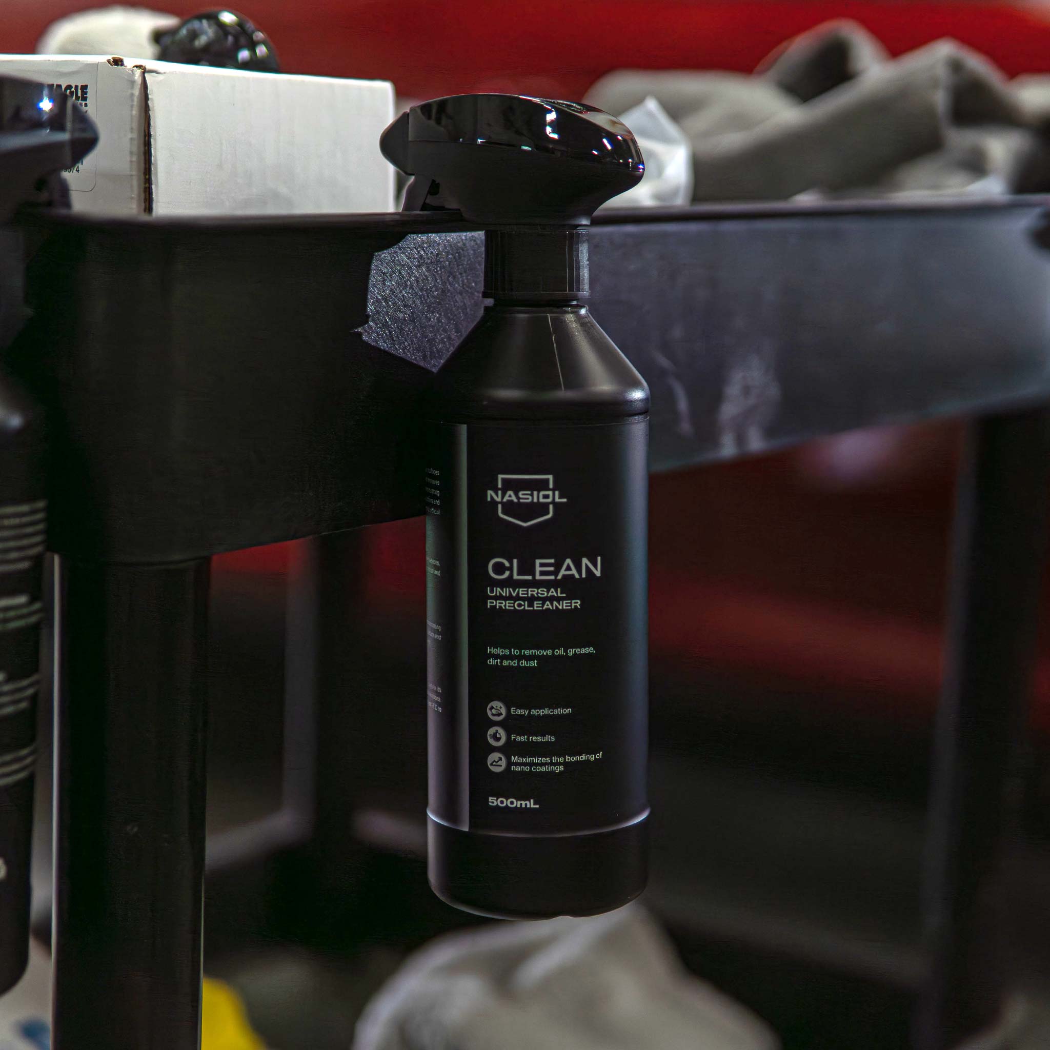 Nasiol Clean spray handing from a detail cart