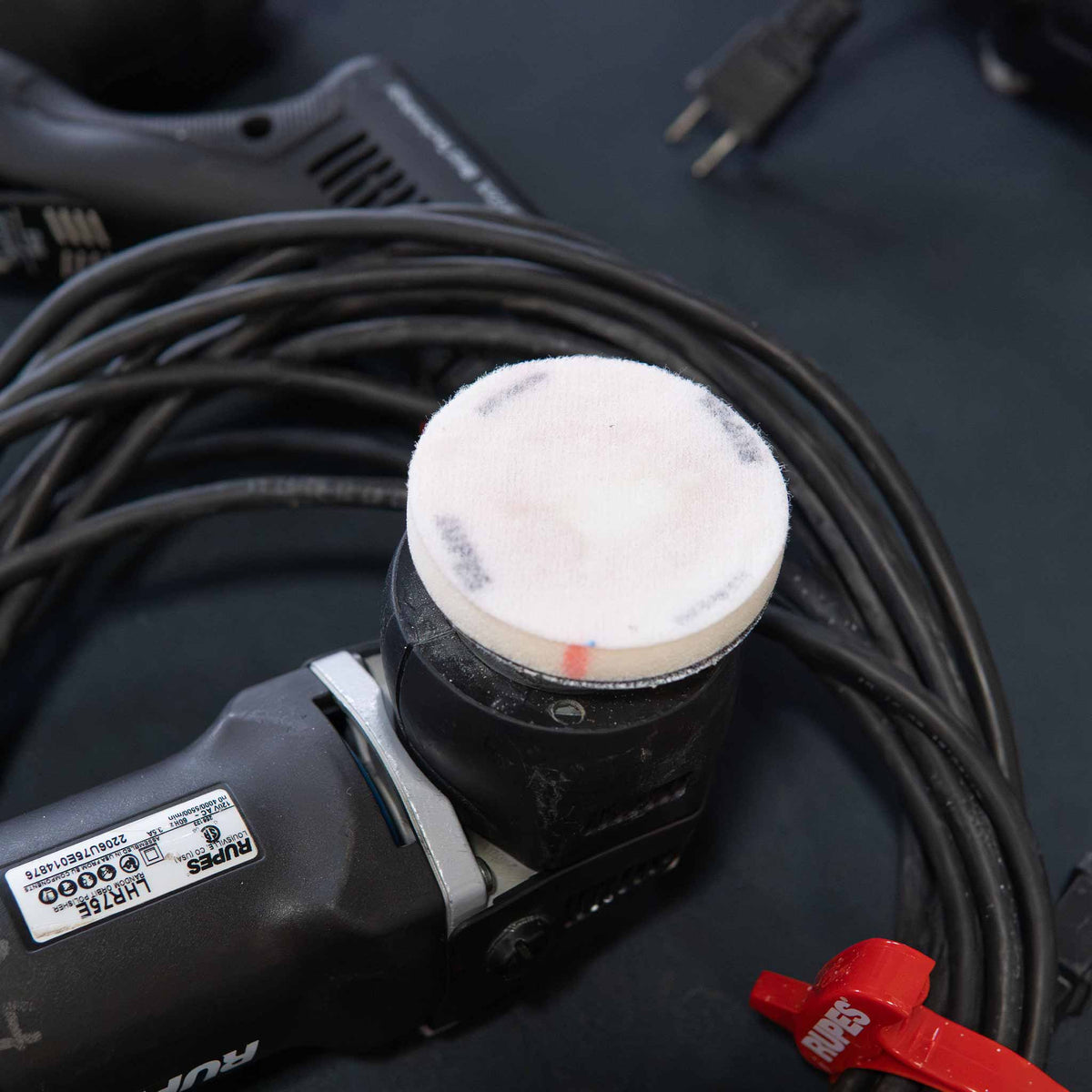 RUPES 3 inch no hole interface pad mounted on a RUPES LHR75E mini tool