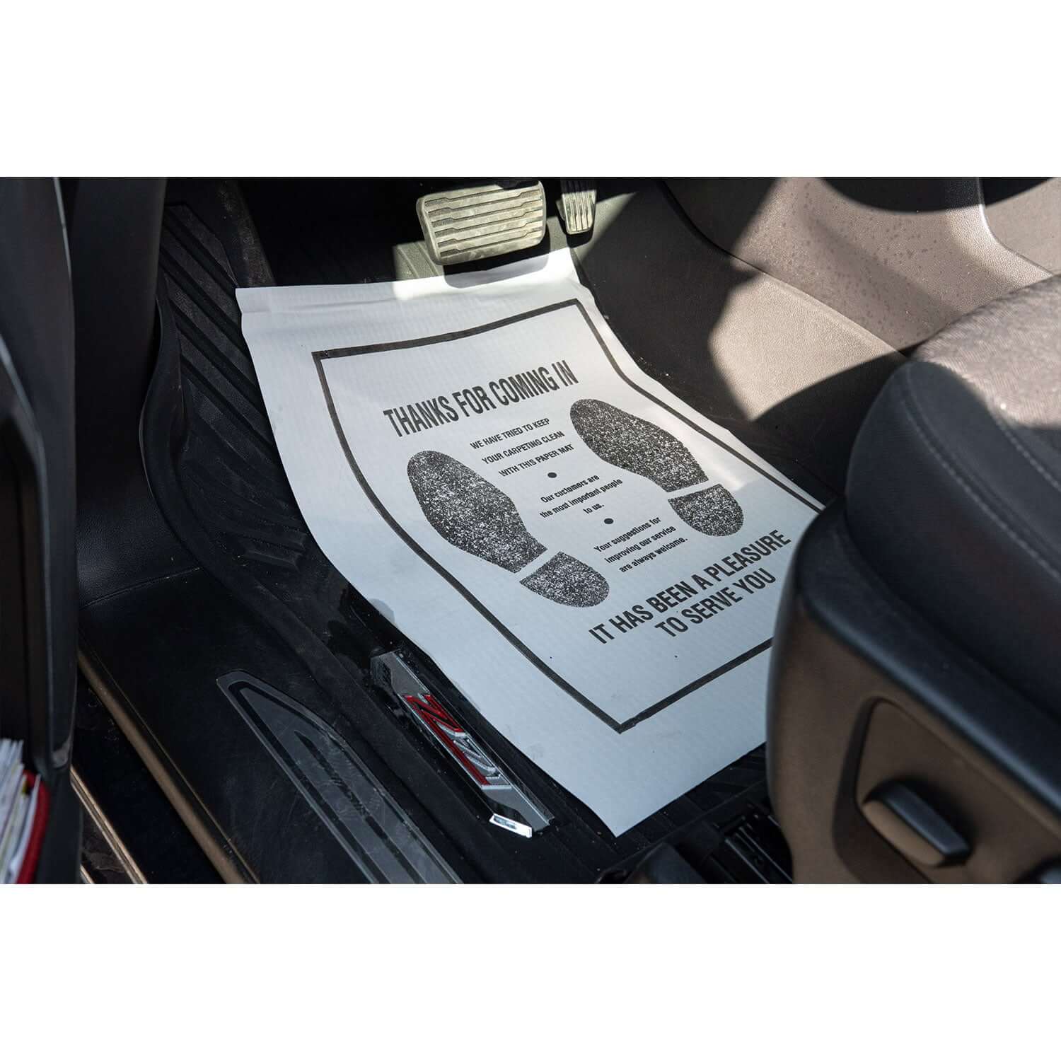 paper floor mats in vehicle