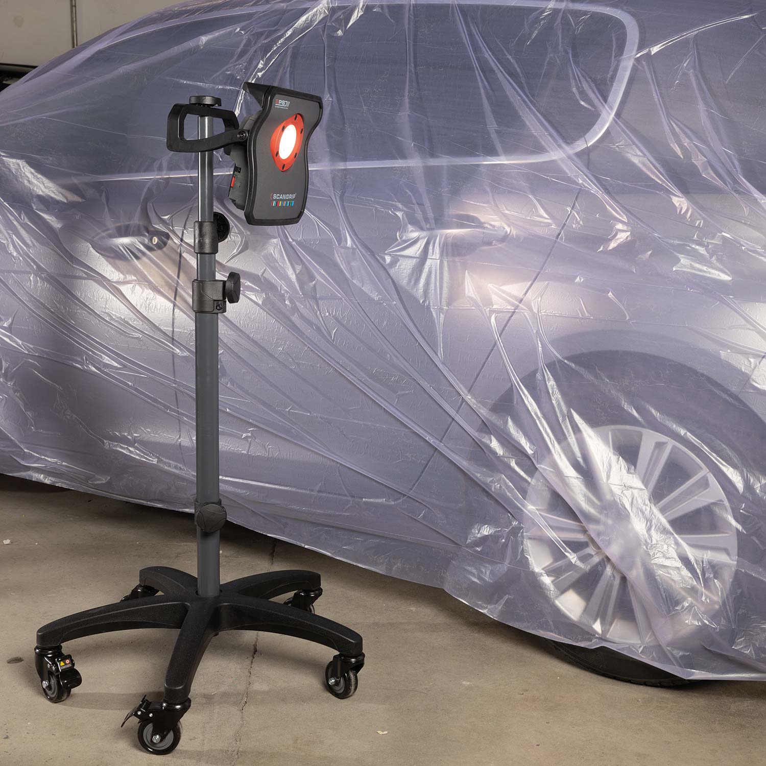 Scangrip Wheel Light Stand in a body shop