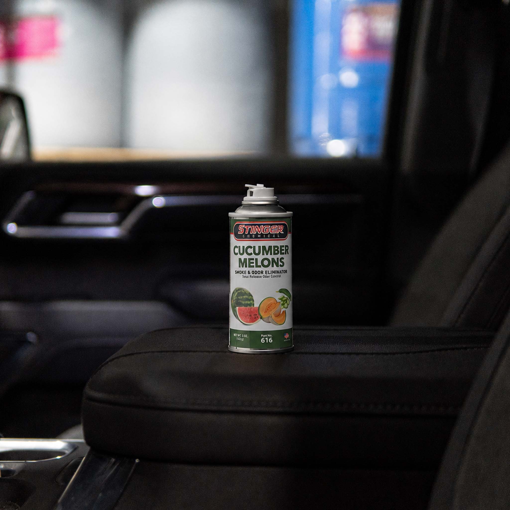Can of Stinger cucumber melons in a car's center console