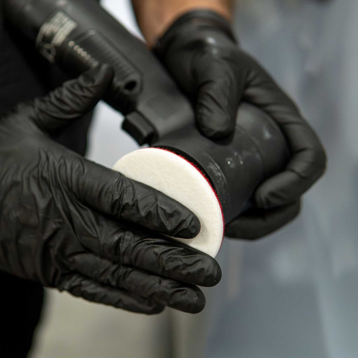 Attaching a Stinger rayon glass polishing pad to a 3 inch dual action polisher backing plate