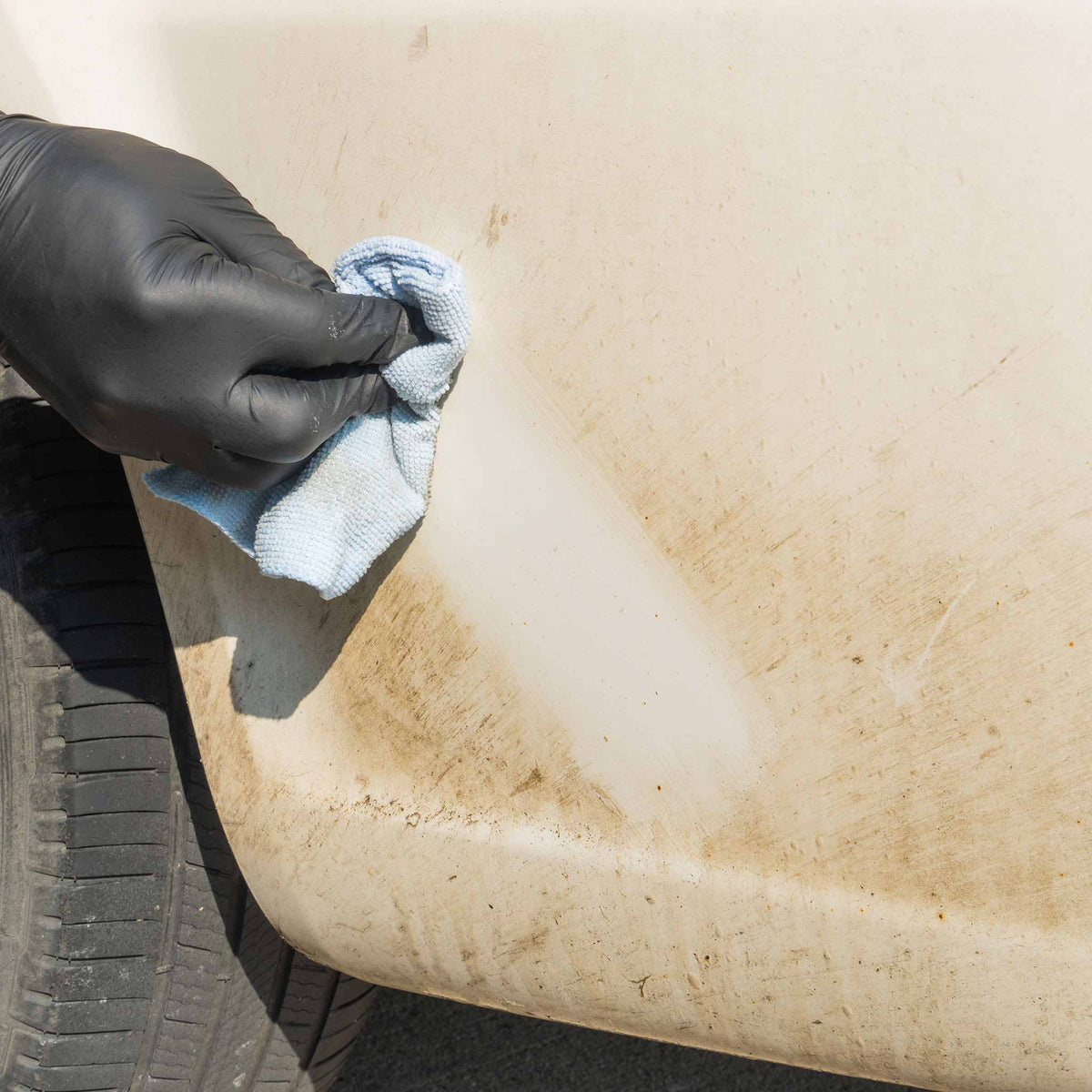 Stinger Chemical Orange Crush 731 road tar wiped off a white lower panel with a microfiber towel
