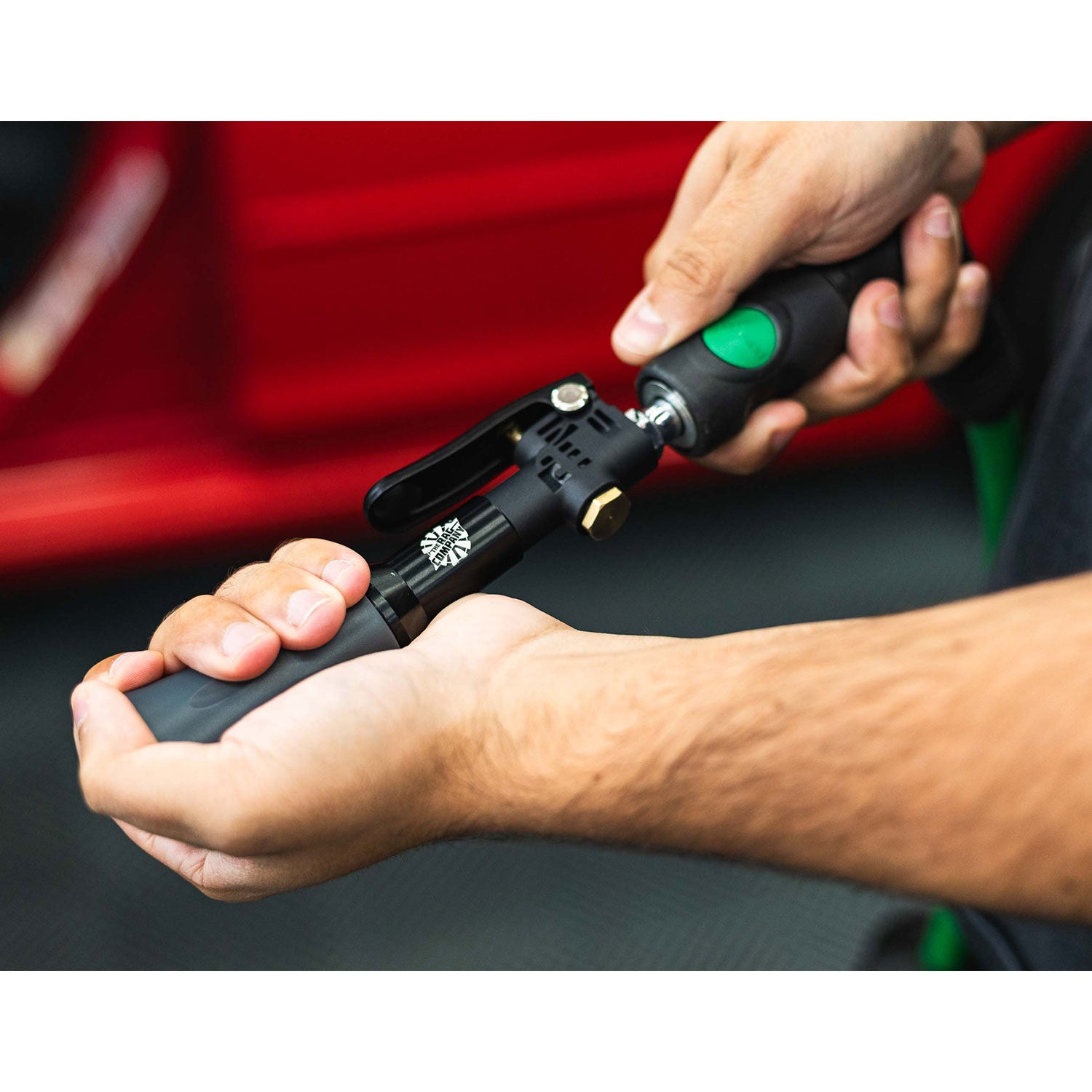 Person holding a TRC Mini Blaster with air connection