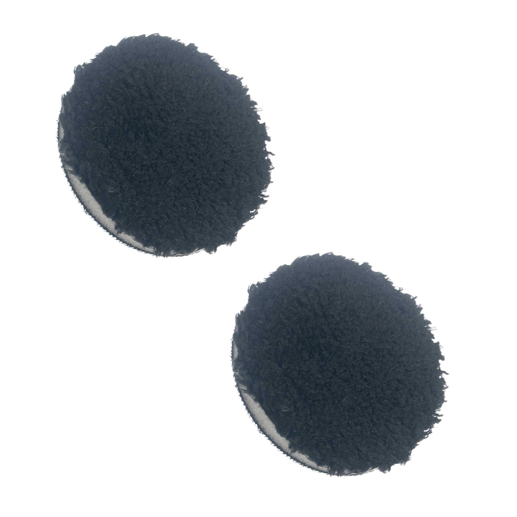 Two 3 inch black polishing pads on a white background