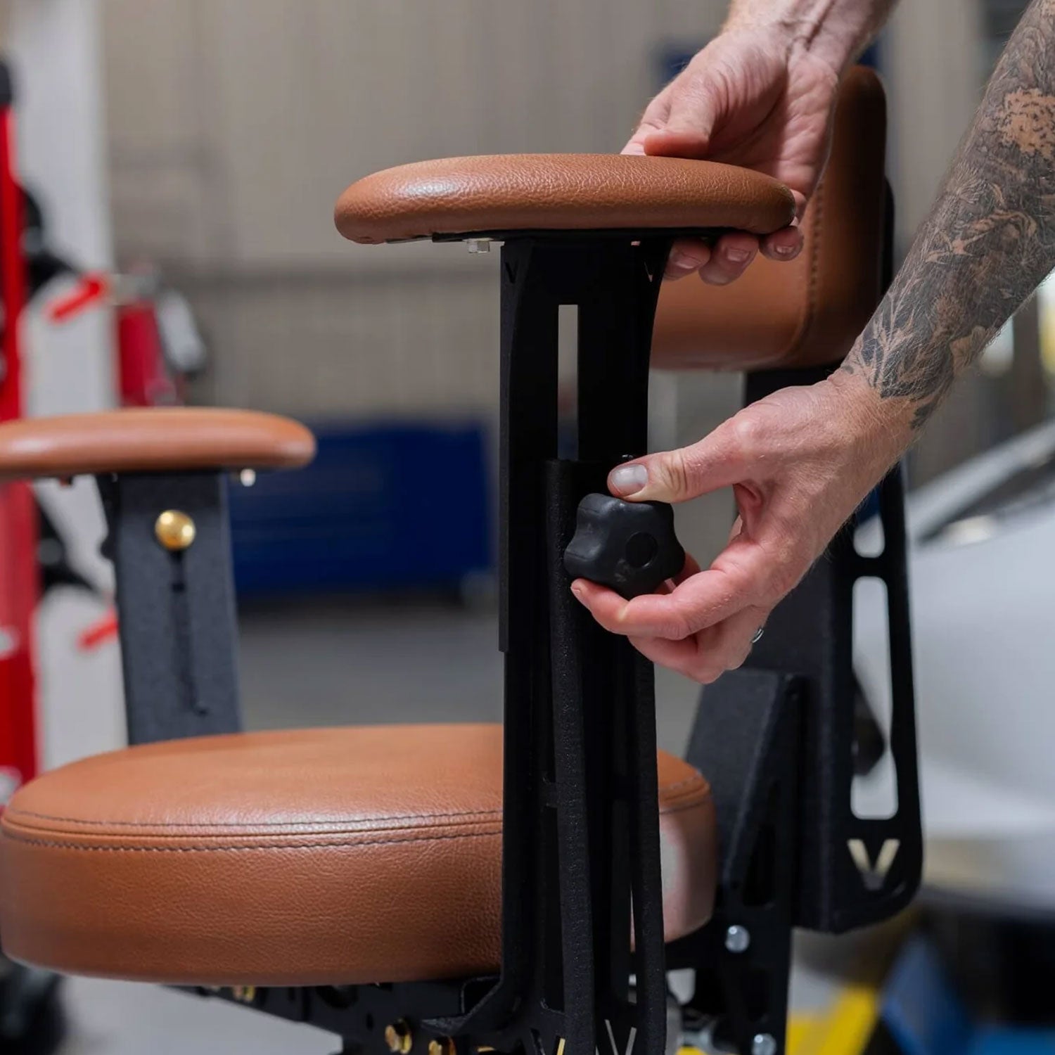 vyper adjusting the armrest in a shop setting