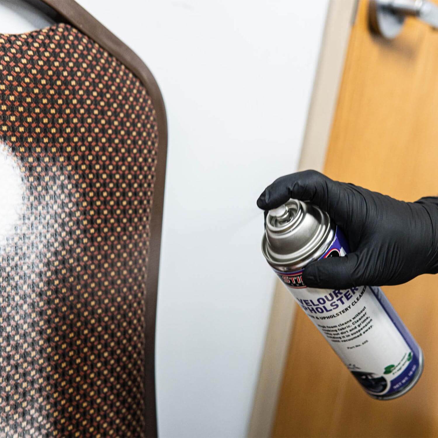 velour and upholstery cleaner spraying