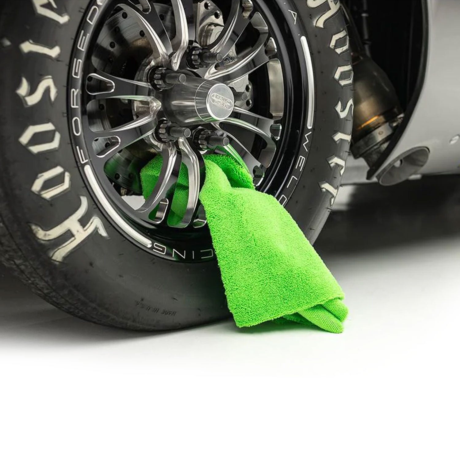 creature-drying-towel-in-race-car-wheel