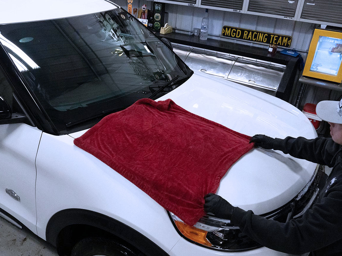 Drying a Car with a Red Drying Towel