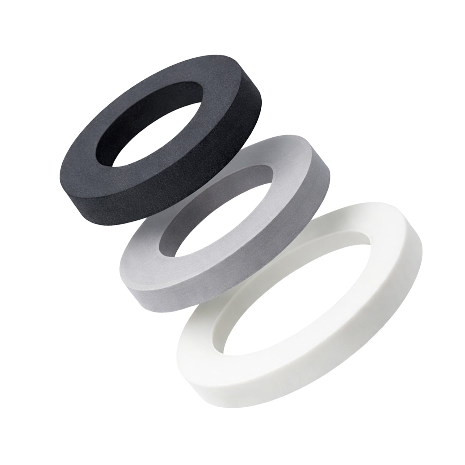 Three circular foam gaskets in black, gray, and white on a white background