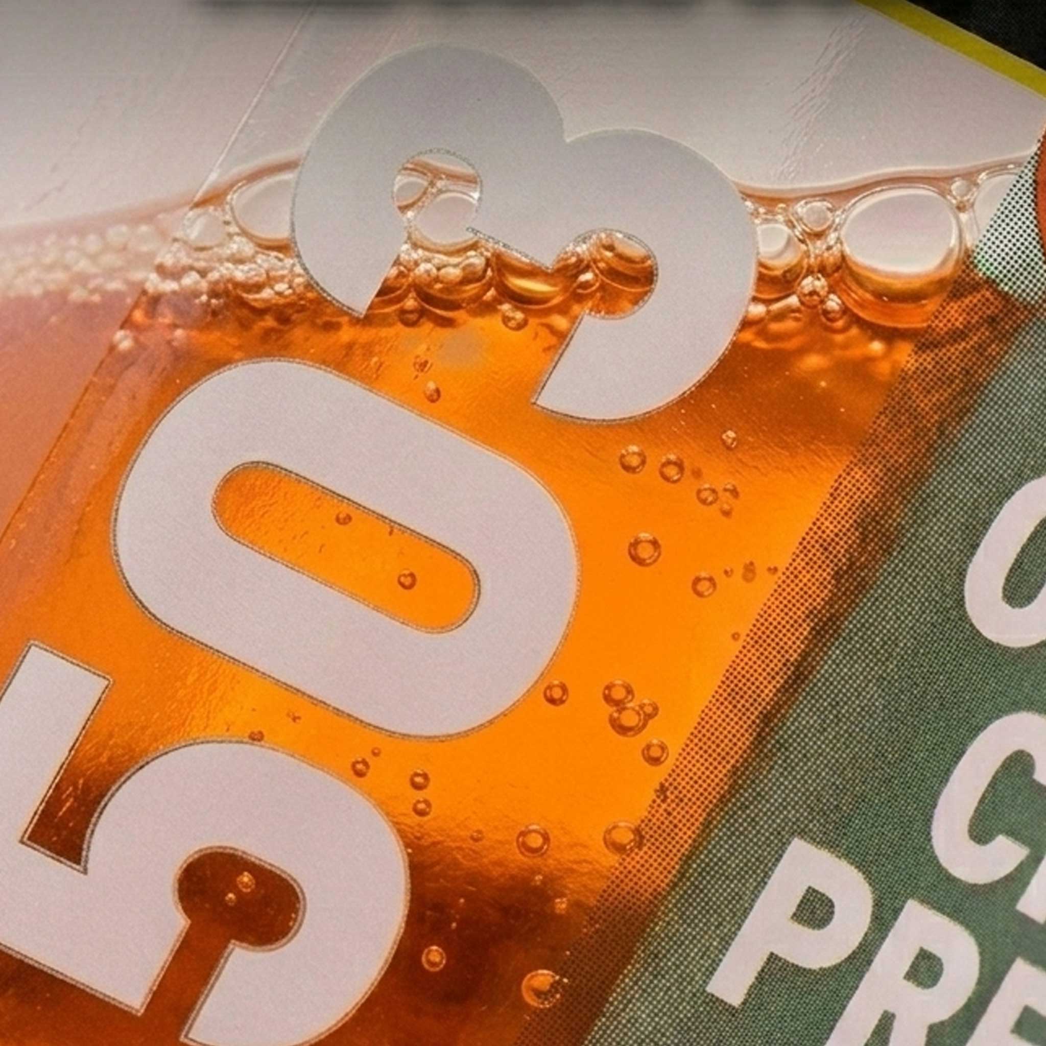 Close-up of a label with '503' on an orange liquid and green label background