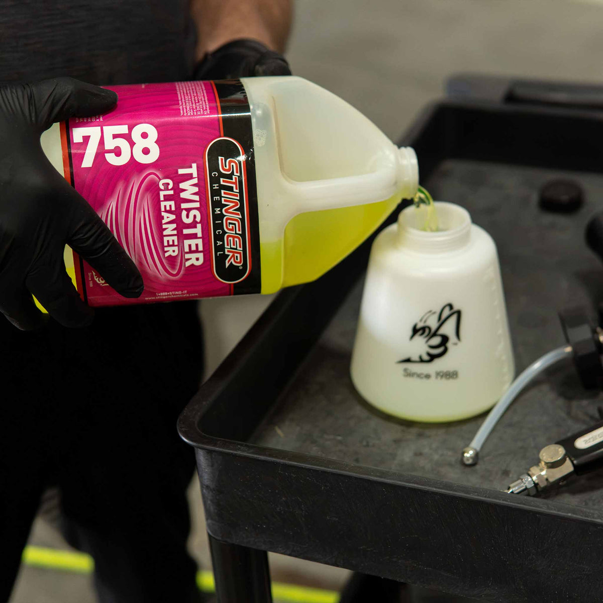 Stinger chemical twister interior cleaner going into a twister cleaning gun