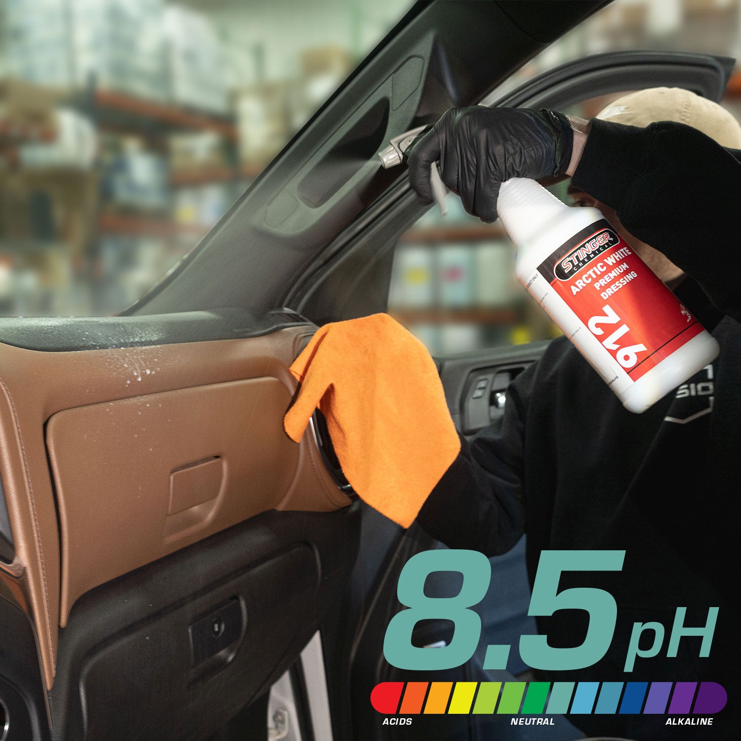 Person cleaning car interior with a bottle labeled 'arctic white dressing' and an orange cloth, with a pH indicator showing 8.5.