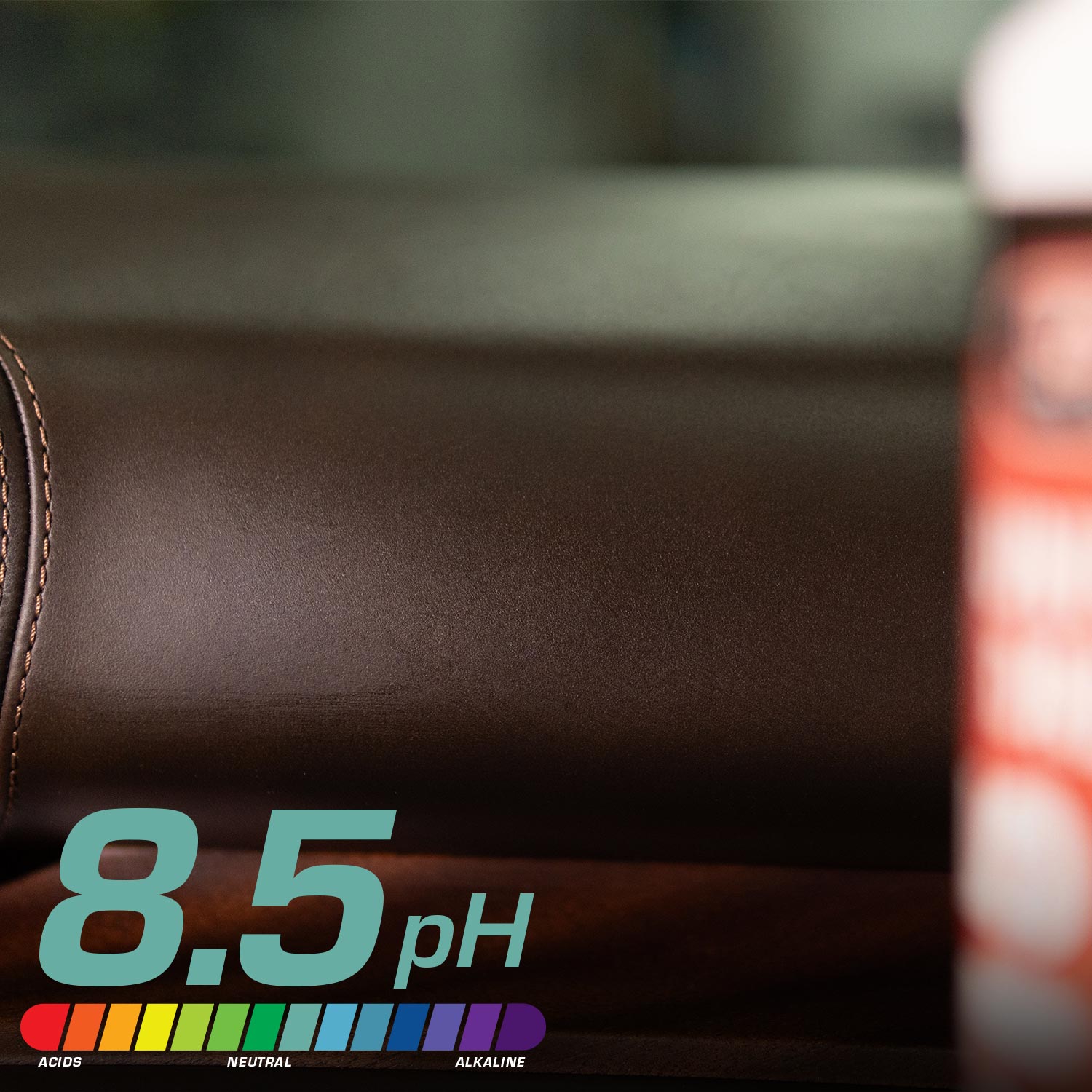 Brown leather surface with a pH scale indicator showing 8.5, blurred background